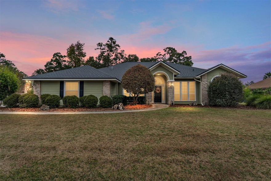 Discover this beautifully updated 4-bedroom, 2.5-bath home with a dedicated office in the desirable Sterling Place community. This move-in-ready home offers modern upgrades, outdoor living and a prime Gainesville location close to top-rated schools, parks, shopping, dining, and major employers.  Step inside to find wood flooring throughout—no carpet anywhere—and a spacious family room featuring a gas fireplace. The open layout flows into the kitchen with granite countertops, plenty of cabinetry, stainless steel appliances, a breakfast nook, closet pantry and a separate formal dining room. The owner’s suite is good sized with two custom walk-in closets. The renovated spa-inspired bathroom is a true retreat, showcasing board-and-batten accents, dual vanities, a freestanding soaking tub and a walk-in shower with multiple shower heads, decorative tile and Carrara marble counters. Secondary bedrooms are comfortably sized, and the redesigned guest bath has a new vanity and marble countertops. Enjoy outdoor living with a covered and screened lanai ideal for year-round enjoyment, plus a paver patio with fire pit—the perfect spot to unwind or entertain. Additional highlights include a side-entry two-car garage, full irrigation system, landscape lighting, and a fully fenced backyard. Walking trails near the community. Conveniently located minutes from I-75, US-441, UF/Shands, NFRMC, shopping and restaurants. This home offers the best of Gainesville living.