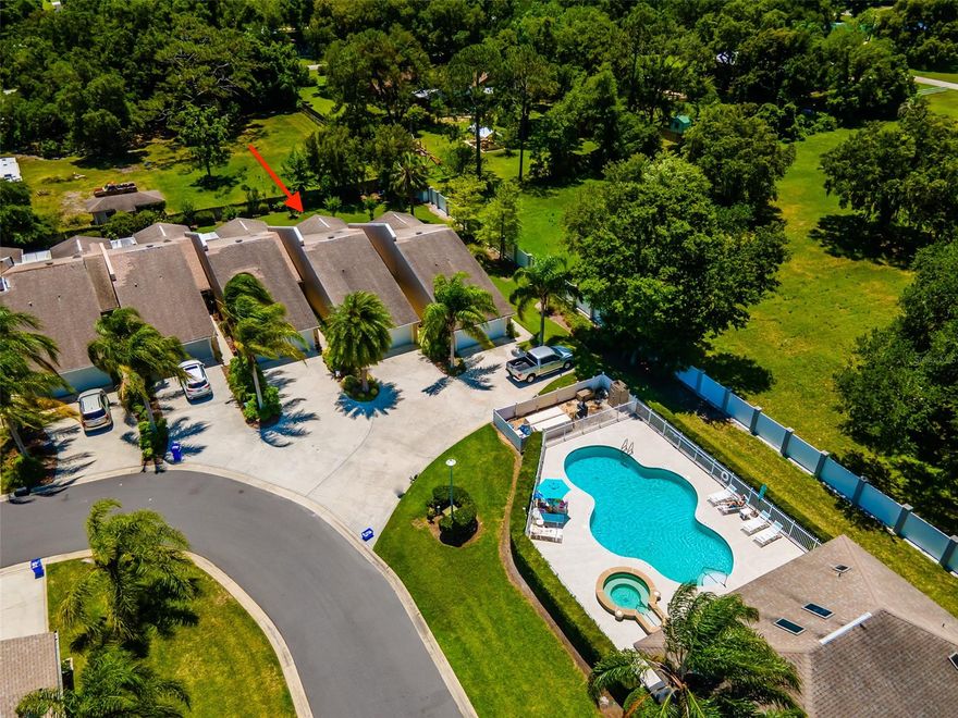 This stunning townhome is tucked away in the quiet subdivision of Hawks Cove, located right off State Road 44. Situated only a few steps away from the community pool, this 2 bedroom 2 bath townhome is very spacious offering vaulted ceilings, skylights, open floor plan, walk in closets and tile throughout. Enjoy the bright Florida room leading you out to a large, private screened patio overlooking the beautifully landscaped backyard. New AC in 2018, kitchen includes granite countertops, a pantry, new garbage disposal and new faucet. You'll be able to enjoy the nearby community pool, clubhouse, tennis court, and a pond and community gazebo where you can feed the ducks. Low HOA fees and low maintenance so you can sit back, relax and enjoy all that New Smyrna Beach has to offer. Great location with several shopping and dining options just down the street and only 10 minutes to the beach! Call today to schedule your showing as this home won't last long. ;Water: City