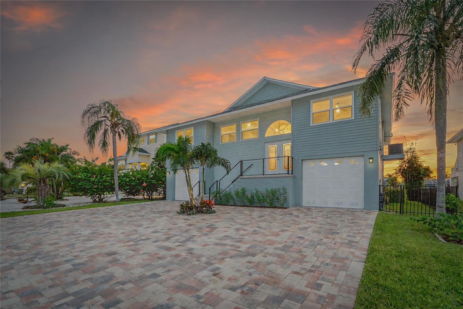 Waterfront Paradise with Modern Upgrades! Welcome to your dream home in the highly sought-after Sea Pines neighborhood of Hudson Beach, where salt life living meets cotton candy sunsets on Florida’s stunning Nature Coast. Golf cart friendly community. This fully renovated 2-story waterfront retreat offers the perfect blend of modern luxury, laid-back coastal charm, and unbeatable outdoor living. Step inside to discover 1,830 sq ft of heated living space (over 4,200 sq ft total) featuring a bright, open layout and stylish finishes throughout. The entire home was meticulously renovated just 1.5 years ago, including: Modern kitchen with quartz countertops, pot filler, wine fridge, oversized window overlooking the water, double ovens, and all-new appliances, Ship-lap ceilings, new tile flooring with sound-deadening underlayment upstairs, 3 full bathrooms completely updated with designer touches, Master suite plus 2 additional bedrooms and a guest bed room, Downstairs entertainment space with laundry room, fridge hookup, and open-concept design – perfect for hosting, New tankless water heater, all-new plumbing, new water softener system. Step outside to your personal backyard oasis: Freshly updated pool, Travertine pool deck surrounded by tropical landscaping, Tiki bar and grill plus a live edge wood bar top ideal for Florida entertaining, 2 Docks. A Floating dock for kayaks, jet ski, etc.. A second dock has a custom fish cleaning station along with a 10,000 lb boat lift ( can be set up for catamaran or V hull ). Deep water canal minutes from the Gulf. Additional highlights include 2 garages with tool room, storage racks, a brand-new paver driveway, full irrigation system, and ample storage throughout.
Whether you’re an avid boater, beach lover, entertainer, or just looking for peaceful waterfront living – this home has it all. Don’t miss your chance to live the salt life in Sea Pines! Transferrable flood insurance policy at just over $1000 annually! WOW!