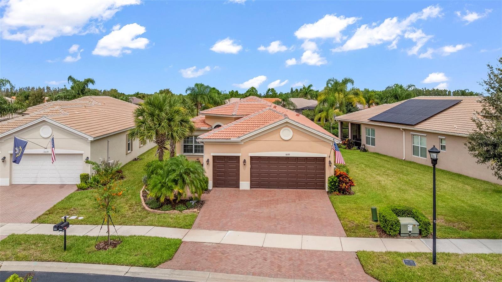 Experience Luxury Living with Unmatched Resort-Style Amenities in Valencia Lakes! Welcome to the Florida Lifestyle you’ve been dreaming of. This highly sought-after Palazzo model offers not just a home, but a true Florida experience in Valencia Lakes, which is Tampa Bay’s premier 55+ Resort-Style Community. Whether you’re looking for your Forever Home or a Seasonal Retreat to escape the cold, this elegant residence delivers the perfect balance of sophistication, comfort, and leisure. From the moment you step through the grand 8-foot impact glass double doors, you’ll be captivated by the soaring 11-foot coffered ceilings, sun-drenched open spaces, and the effortless flow between the Great Room, Chef’s Kitchen, casual dining, and formal dining areas. Entertain with ease or simply relax as triple sliders draw your eye out to the extended screened lanai, where sparkling water views and stunning sunsets create a picture perfect setting for coffee at dawn or cocktails at dusk. The Chef’s Kitchen is a showpiece that includes granite countertops, 42" custom cabinetry, under-cabinet lighting, designer backsplash, and premium appliances all come together to inspire your culinary creativity. For holidays and special occasions, the formal Dining Room is just steps away, adding a touch of elegance to every gathering. Your Primary Suite Retreat is a sanctuary, complete with water views, coffered ceilings, and dual custom walk-in closets. The spa-inspired Ensuite pampers you with dual vanities, a makeup station, granite finishes, and a walk-in shower with built-in seating. Two spacious Guest Bedrooms are tucked away for privacy, while the versatile den with custom built-ins is perfect for an office, library, or creative space. This Beautiful Home is filled with thoughtful extras that include: high-impact windows, custom hurricane shutters; gutters; designer lighting; built-in closets; water softener; reverse osmosis system; an oversized 3-car garage with storage racks, insulated door; an air conditioned-garage; a utility sink and cabinets in the Laundry Room; and an extra freezer/refrigerator in the Garage. This beautiful Home is offered partially furnished (Primary Bedroom furniture and Office bookcase and credenza) and is move-in ready! Beyond your front door lies the Resort-Style Lifestyle of Valencia Lakes: a 40,000 sq. ft. clubhouse, 24-hour fitness center, sparkling pools, tennis, pickleball, bocce, bistro café, live entertainment, arts & crafts, cooking classes, and endless social clubs. Every day feels like a vacation in this vibrant, active community. Don’t just dream it, live it. Situated close to great shopping, restaurants and the Beautiful Gulf Coast Beaches, this extraordinary home is the opportunity you’ve been waiting for. Schedule your private tour today and see why Valencia Lakes is the perfect place to call home.