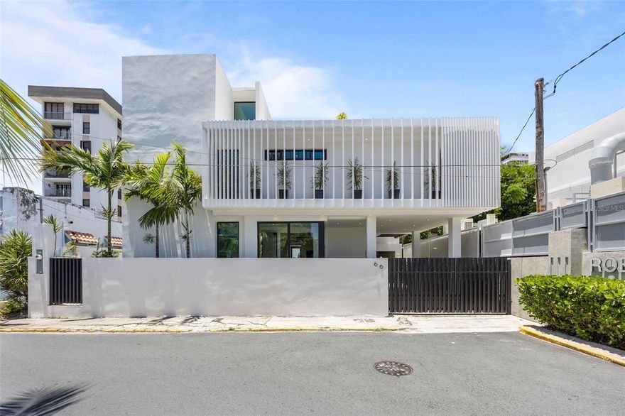 Situated in the coveted Condado neighborhood of San Juan, this fully renovated single-family home blends high-quality construction with modern design in a truly turnkey offering. Rebuilt in 2024 from the ground up, the residence spans approximately 4,000 square feet on a 5,000 square foot lot and features four spacious bedrooms, an office or convertible fifth bedroom, five full bathrooms, plus a half bath and an exterior bathroom and two outdoor showers that seamlessly connect indoor and outdoor living.

The thoughtfully planned layout supports both everyday comfort and effortless entertaining. Each bedroom offers generous proportions, custom Italian closet systems, and direct access to private louvered patios that invite natural light and cross-ventilation while maintaining privacy. Electric shades throughout the home add convenience and a cohesive, contemporary aesthetic.

At the heart of the property, the newly designed kitchen is outfitted with brand-new KitchenAid appliances, including a dishwasher, and is tailored for modern living with sleek finishes and efficient workflow. The pool area serves as a central gathering space, ideal for relaxing or hosting, while essential infrastructure upgrades such as a water cistern and full backup generator provide reliability and peace of mind.

A private rooftop patio expands the usable living space and is perfect for open-air dining and entertaining. This elevated retreat includes a built-in cement dining table, sink, and wine fridge, creating a functional outdoor kitchen and lounge environment.

Located near St. John's School, Robinson School, and Condado's renowned dining, shopping, beaches, and entertainment, the home offers exceptional convenience in one of Puerto Rico's most established urban neighborhoods. Sold fully furnished and move-in ready, this property delivers a rare combination of style, comfort, and long-term value in Condado real estate.