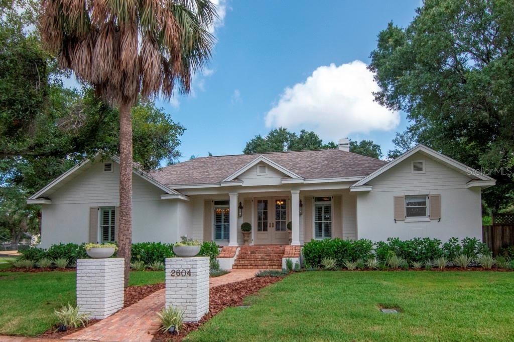 Tucked away on quiet, tree lined Beach Drive in the heart of prestigious Sunset Park, this elevated, custom-built home offers a rare combination of privacy, elegance, and everyday comfort...all on one level. Situated on an oversized corner lot nearly 1/3 of an acre and one of the highest points of Sunset Park, you'll be welcomed by a charming natural brick walkway, front porch with gas lanterns, and lush landscaping. Inside, light pours through plantation shutters, highlighting crown moulding, designer finishes, and wide-open living spaces. The thoughtfully updated kitchen features a Thermador gas range top, Fisher & Paykel dishwasher, KitchenAid convection oven and microwave, and ample island storage. Enjoy seamless indoor-outdoor living with a covered brick porch that opens to a sparkling pool and expansive pavered deck. This is the perfect spot for entertaining or quiet afternoons in the sun. Retreat to the serene primary suite with natural seagrass carpet, three closets, and a primary bathroom with separate vanities, a large soaking tub and separate shower. The remodeled secondary bath boasts a dual vanity and timeless finishes. Other highlights include custom closets with built-in drawers, EV charging in the oversized two-car garage, a new roof (2022), full Kinetico water treatment system, and a peaceful non-through street location. Built in 1999 and elevated for added peace of mind, this home checks every box. Don’t miss your chance to see it in person.