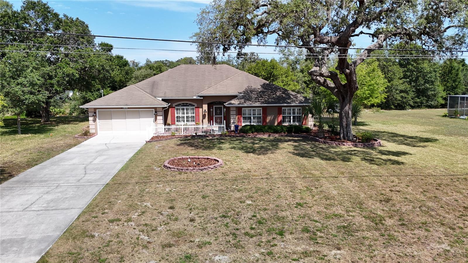$34,000 PRICE REDUCTION! Gorgeous one-story 4 bedroom / 3 full bath pool home with attached 2 car garage with 3217sf of living space situated on 1/3 acre lot. Functional interior layout includes custom plantation shutters on all windows, immense living room with separate dining area includes laminate wood flooring and high ceilings through living areas and all bedrooms. Immense kitchen with walk-in pantry, ample cabinets, counter space, stainless-steel appliances and large center island is perfect for entertaining large gatherings. Primary bedroom located in rear of home features tray ceiling and recently renovated primary bath with dual sinks, spa-inspired shower, wood look tile flooring and dual closets. Additional three spacious secondary bedrooms include generous closet space. Rear of home features fully enclosed Florida room over looking patio and in-ground pool. Exterior highlights include paver patio with in-ground pool, storage shed and raised landscaping beds a arching around front of home. Great 1/3 acre lot located in a NON HOA / CDD area of Spring Hill within 15 minutes of the Gulf of Mexico!