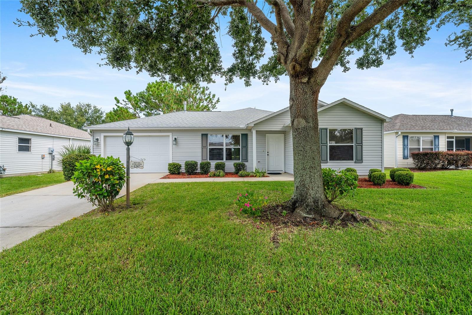 If you are searching for a Villages home with a private backyard in a convenient location, this might be the home for you. It is located in the Village of Liberty Park, just off Buena Vista Boulevard, between Lake Sumter Landing and the many stores and restaurants on Rt. 466A. This 2 bedroom, 2 bath Austin model cottage home features a panoramic view of a nature preserve which you can enjoy while relaxing on the newly glass-enclosed lanai. Other pluses include a volume ceiling in the great room, a new roof in 2022, a newer gas water heater in 2018, and also a newer HVAC in 2018. The bond is paid, and a one-year Broward Home Warranty is included.
Priced to sell in today’s market, please stop by and view it in person.
