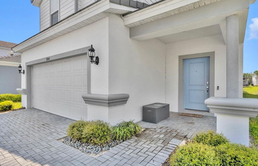 Photo of 7204 Oakmoss Loop, Davenport, FL 33837 (MLS # O6394455)