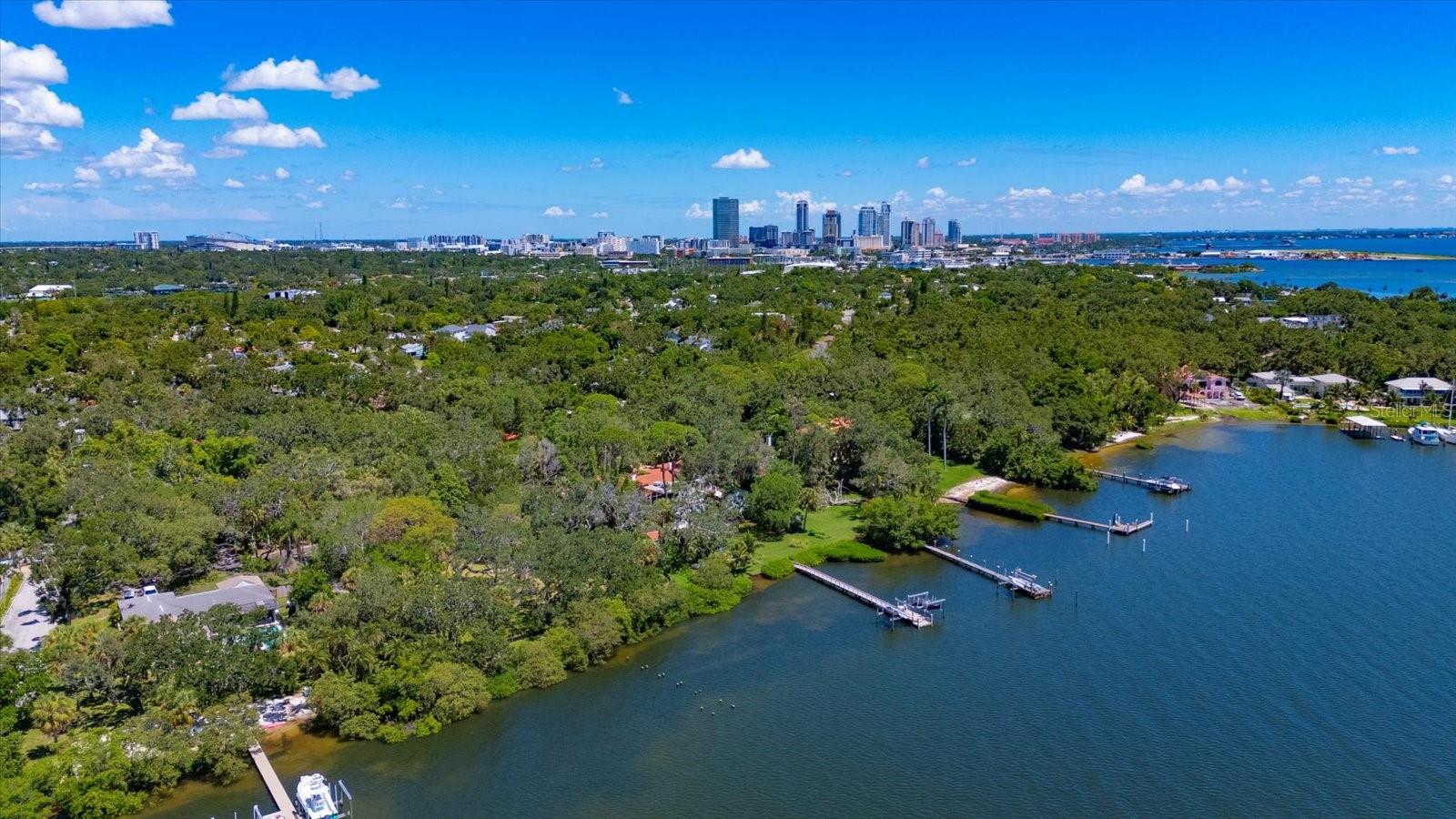 Magnificent Oversized Waterfront Double Lot in Historic Driftwood
Build your dream home and private dock on this rare, oversized double lot with 200 feet of waterfront nestled in the heart of the coveted Driftwood neighborhood. Surrounded by mature oak, palm, and pine trees, this residential waterfront property offers unmatched privacy and natural beauty.
Located on scenic Big Bayou with sweeping views of Tampa Bay, this deep-water homesite provides direct access to the Tampa Bay and the Gulf of Mexico with no fixed bridges—perfect for sailboats and yachts alike. Enjoy daily visits from dolphins and manatees, and wake up to breathtaking sunrises over the water.
Driftwood is one of St. Petersburg’s most treasured neighborhoods, known for its historic homes, majestic tree canopy, and winding, pedestrian-friendly streets. Just a short stroll away is Lassing Park, a hidden gem on the waterfront and a renowned spot for kite surfing and recreation.
Big Bayou offers protected harborage with sailboat-depth water and easy boating access to Tampa Bay, Salt Creek Marina and other nearby marinas enhances your waterfront lifestyle with added convenience for boaters.
All of this is just minutes from vibrant downtown St. Pete—home to world-class museums, shopping, dining, entertainment, parks, and sporting venues. Quick access to both Tampa Bay airports makes this location as practical as it is picturesque.
This is a once-in-a-lifetime opportunity to build a custom estate in a historic, tree-lined waterfront enclave. Don’t miss your chance to create something truly special in Driftwood.