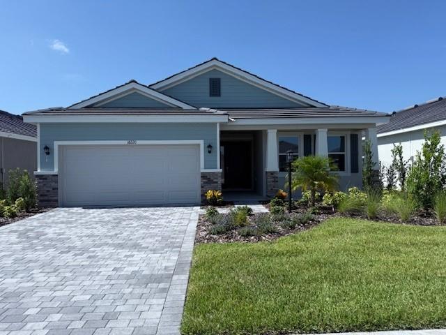 MOVE IN READY! REDTAG SALE: Receive up to $25,000 towards closing costs and special interest rates with the use of our preferred lender Now to July 31st.This one-story, all concrete block constructed home has a truly open concept plan, featuring a spacious kitchen with a large granite kitchen island that overlooks a large dining area, great room, and breakfast nook which flow out onto a covered lanai. The first phase of The Resort Club amenity center is NOW OPEN, including Trade Route Coffee Kitchen, Resort Style Pool, Fitness Center, Athletic Performance Center, and Pet Park. Future phases of The Resort Club will include a poolside bar & grill, outdoor activities area, The Event Center, and The Terrace Chef’s Patio. Future amenity centers, Adventure Retreat & Cabana Corner, will include Pickleball, Tennis & Bocce Courts, Pet Park, Golf Cart Parking, Sunset Terrace, Clubhouse, Resort Pool & Spa, Resistance Pool, Poolside Cabanas & Beach Area, Outdoor Activities Area, Poolside Grilling and more. This home comes with stainless steel dishwasher, range, and microwave. Pictures, photographs, colors, features, and sizes are for illustration purposes only and will vary from the homes as built. Home and community information including pricing, included features, terms, availability and amenities are subject to change and prior sale at any time without notice or obligation.