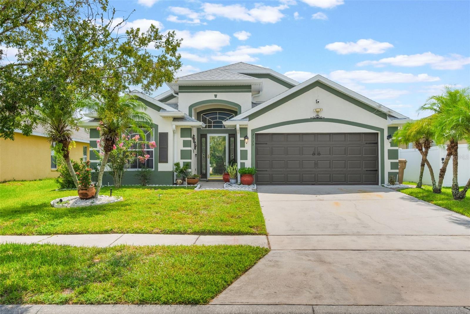 Welcome to 2335 Andrews Valley Drive in the prime location of Kissimmee, FL! This charming 3-bedroom, 2-bathroom residence offers a generous 1,867 square feet of comfortable living space. As you step inside, you'll find a cozy bonus room or den with luxury vinyl plank flooring to the left of the foyer—perfect for an office or hobby space. This home comes with a new roof and is equipped with an HVAC system that is just a year old, providing peace of mind for years to come. Very Florida insurance friendly. Although the water softener is currently disconnected, it's available for future use. A 5-year-old water heater ensures consistent hot water supply, while security cameras enhance the home's safety features and can be transferred to new owners. Ceramic tile runs throughout the main living areas, adding a touch of elegance as well as new paint inside and out. The fully fenced yard offers privacy, and the home backs up to conservation, offering total privacy and a serene natural backdrop. Enjoy the screened lanai, perfect for relaxing and soaking in Florida's lovely weather. The primary bedroom boasts vaulted ceilings, and the en-suite bathroom is handicap accessible for added convenience. All appliances are included, making your move-in seamless. Additional features include a storage shed for extra space and an irrigation system to maintain your landscaping. Don’t miss the opportunity to own this wonderful home in one of Kissimmee’s most sought-after areas!