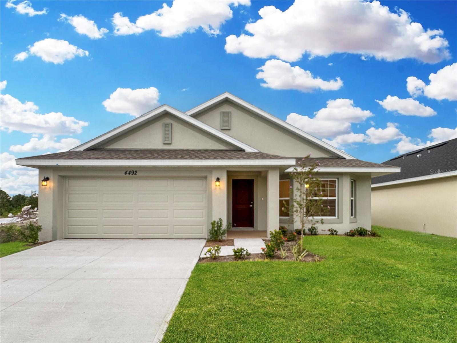 Brand New move-in ready Home 3 bedrooms and 2 bathrooms. ** Receive Up to $20,000 FLEX Cash that can be used to buy down interest rate and or prepaids and closing costs assistance so this will save you thousands with prefered lender must close within 30 days. This home is perfect for entertaining with its open floor plan. The upgraded kitchen features granite thru out the large island and counter tops. This kitchen has beautiful Whirlpool stainless steel appliances. You'll also love the spacious laundry room. The bathrooms are spacious and elegant with beautiful granite. Rest easy knowing your new home comes with a 1-year builder warranty and a 10-year structural warranty. Located near Harmony Main where you can enjoy the great amenities such as 12.5 miles of Trails and pathways, go and play at the stunning golf course Harmony Golf Preserve and even become a member of the community garden program. Harmony Central provides an everyday escape from ordinary living, this location offers both convenience and leisure. This is the last Harmony Community with No CDD and a very low HOA that will feature a beautiful community pool with cabanas.