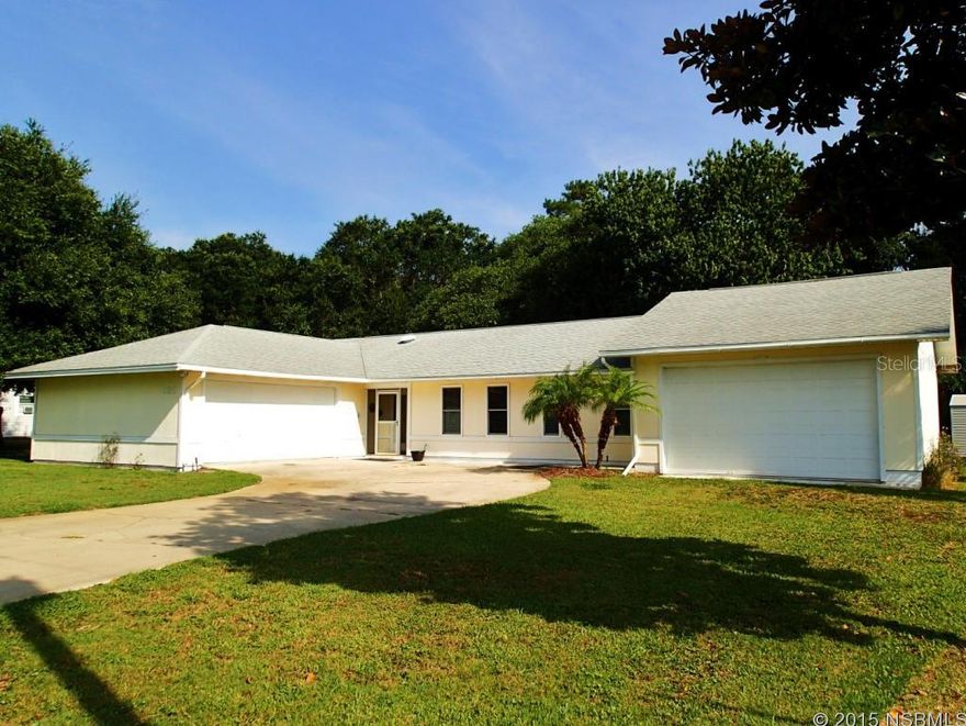 Beautiful, spacious home with deeded Intracoastal Waterway access at the "residents only" boat ramp and fishing dock just at the end of the street. This super-clean move-in ready 3 bedroom, 2 bathroom homes features TWO attached 2-car garages, and a very large screened porch with tile floor, ceiling fan, and a refrigerator, facing a shady backyard with mature trees and private woods. There's plenty of room to store your boat in one of the garages, and the boat ramp is very close to world-class inshore saltwater fishing. The large living room has a high ceiling with 2 skylights and a beautiful wood-burning rock fireplace. There is a lovely bay window in the dining room with storage in the bench, a spacious kitchen with a double oven and breakfast bar, a beautiful master suite with chair railing, recessed ceiling-mounted reading lights, wallk-in closet, and gorgeous master bathroom. The home also features concrete board siding, two storage sheds, and an irrigation system on well. (Listing information thought to be reliable but is not guaranteed to be accurate; you are advised to verify the facts that are important to you. Room measurements are approximate.) ;Water: City