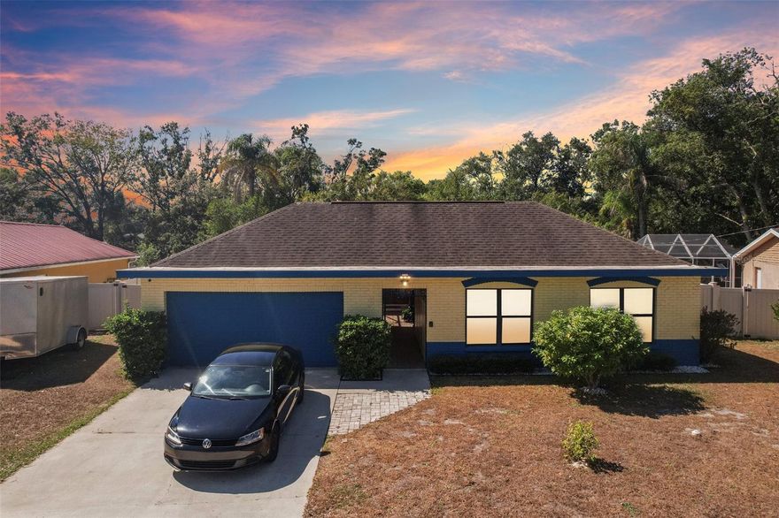 Welcome to this inviting 3-bedroom, 2-bathroom pool home with no HOA—offering the freedom to live your way! All furniture is negotiable, making this an easy and flexible move-in opportunity.

You’re greeted by a spacious screened courtyard, perfect for morning coffee or evening relaxation. Inside, natural light fills the open layout, creating a bright and welcoming atmosphere throughout.

The spacious living area features a striking stone double-sided fireplace, adding warmth and character to the heart of the home. The kitchen offers an island and breakfast bar, seamlessly flowing into the dining area where you can enjoy views of the sparkling pool.

The primary bedroom provides comfort and space, complete with dual closets and a private ensuite with shower. Two additional bedrooms share a full bath, ideal for guests or a home office.

The fenced backyard is a private retreat with an inground pool, plenty of patio space for entertaining, and a shed for extra storage. A 2-car garage adds convenience, and security cameras (subscription required) provide peace of mind.

An assumable VA loan is also available, adding even more value to this move-in-ready home that perfectly captures the spirit of relaxed Florida living—no HOA, great outdoor space, and a layout designed for comfort and connection.