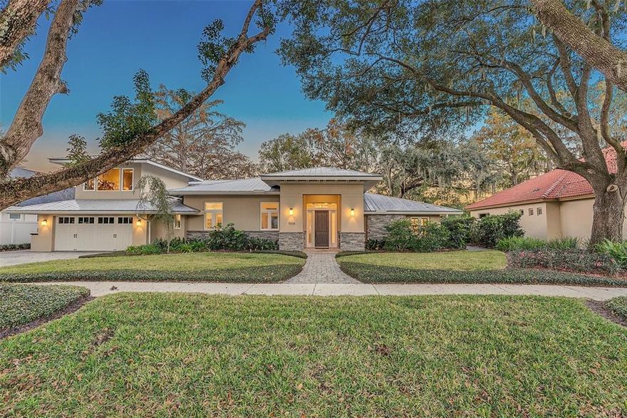 Rare find in desirable Rose Isle.  This 4 bedroom 3 bath home was completed in 2015. The Craftsman style exterior of this home sits on a large lot under a towering tree canopy that includes Oak and Cypress and takes full advantage of views of beautiful Lake Rowena from every room. A bird watchers retreat, some 65 plus species of birds have been observed from the property, among them Bald Eagles, Wood Storks, Great Blue Herons, American Egrets and many others.   Entering the modern interior of the home, the 12 foot ceilings allow one's eye to drift to the lake's edge and the host of ducks inhabiting the shallows. The Living/Dining area features two large sets of pocket sliding doors as well as clear story windows. As with all windows and doors, impact/hurricane glass by PGT windows (https://www.pgtwindows.com) are featured and carry 20 year manufacturers warranty. These features, together with ground floor block construction and the metal roof, assure storm readiness.  As you enter the home, off the foyer, is a generous sized room that can function as a family room or 4th bedroom.  This room has a large walk in closet, fireplace and jack and jill bath.  Through the bath is a second large bedroom with access to the pool and patio and stunning views of the lake.  The Master suite and third bedroom are on the other side of the home.  The Master suite has a  door leading to the pool and patio area and large windows with incredible lake views.  The ensuite is generous in size with dual sinks, quartz countertops and the shower is a deep walk-in not requiring a door, and all the doorways are generously proportioned.  The third bedroom is also large and features two closets.  Up the beautiful stairwell is  a bonus room with loads of light, great for a studio, work at home office, playroom or bonus room.   The modern open concept kitchen includes: quartz countertop, large breakfast bar, 2 ovens, a microwave, dishwasher, disposal, 2 refrigerators, a double stainless steel sink and fixtures,  a range hood with high power exhaust fan and room for a wine cooler.  Off the kitchen is a walk in pantry and oversized laundry/utility room that houses the second refrigerator and can easily be utilized as a butler’s pantry.  The floors are tiled throughout, with no thresholds.  The home is designed to provide maximum privacy on either side without compromising on windows.  There is ample storage throughout, and each bathroom has a generous linen closet.  The spacious poolside screened patio features both a large covered lanai with 2 skylights and a large open area, directly overlooking the heated lap pool, the landscaped back yard and the lake. The unobtrusive screen pool enclosure assures peaceful enjoyment of the lake breezes . The private heated swimming pool is 36'x8'  and at 4 plus feet deep is designed for swimming. The attached small hot tub heats quickly from the ambient pool temperature.  There is a separate door to a full bath with shower from the pool patio.  The backyard is beautifully landscaped and features a Gazebo for lakeside entertaining.  This home is a rare find! Room Feature: Linen Closet In Bath (Primary Bathroom).