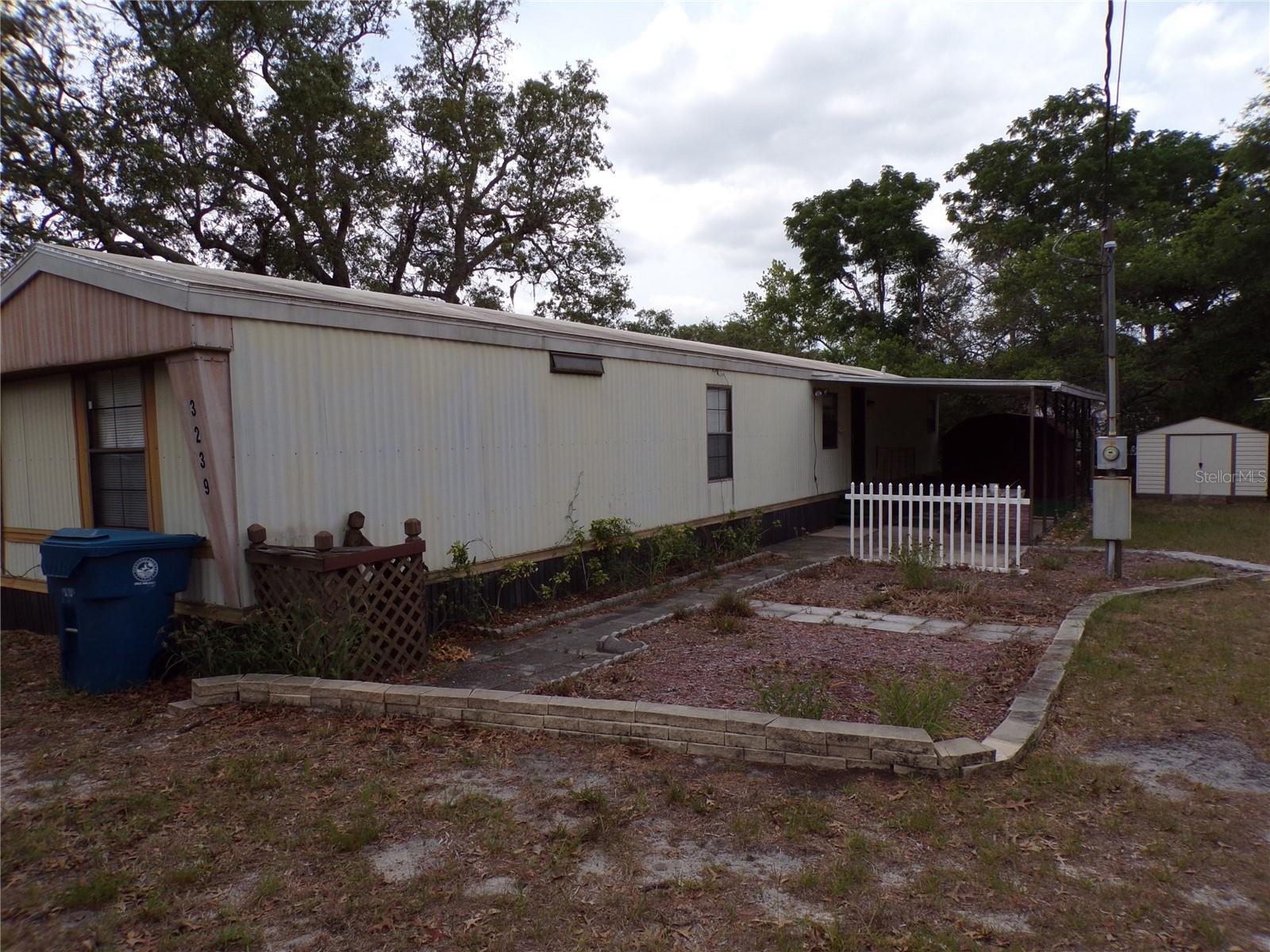 Welcome to Paradise, lovely opportunity to own a 2 bedroom, 2 bath split plan mobile with an extra lot. Plenty of room to park your RV or toys, 2 sheds, super convenient neighborhood near Weeki Wachee State park,restaurants galore, beaches, boat launches, parks and shopping. Deck for relaxing plus open and covered patio for BBQ's and relaxing. Primary suite has garden tub and separate shower. Don't miss out on this great opportunity. Any chattel being left is for the convenience of sellers.