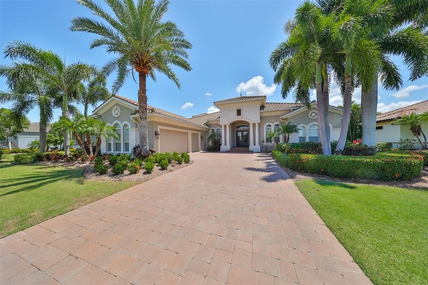 Welcome to this exquisite home, a true masterpiece of design and comfort built by Neal Signature Homes! Gorgeous exterior with luscious landscaping,  pavered driveway, and solid heavy metal wrought iron entry doors. Step inside to discover luxury that will keep you mesmerized, featuring 12ft ceilings on the first floor, coffered ceilings, custom woodwork including crown molding throughout, columns, and expansive windows that bathe the interiors in natural light.  Offering a formal living and dining room with a wine cellar, a large family room, and a breakfast nook, a versatile bonus room with a balcony, a sophisticated club room, and a cozy den/office providing abundant space for relaxation and entertainment. With very distinctive interior features, including impact-rated windows, electric shades throughout the home, 20" luxury ceramic tile flooring in living areas, hardwood floors in the den, master suite, and 2 guest bedrooms, plush stain-resistant carpet on stairs, bonus and guest bedroom upstairs. A Chef Inspired Gourmet kitchen design featuring Conestoga European-Style cabinetry with dovetail and soft close drawers, stylish and staggered cabinets, elegant imported granite and marble backsplash, under cabinet lighting, Wolf & Sub-zero appliances, professional 6 burner gas range, Bosch dishwasher, Butler's pantry, and so much more! This residence boasts four spacious bedrooms and four and a half elegantly appointed bathrooms, offering a perfect blend of style and functionality. The master suite offers incredible views of the pool and lagoon, featuring a tray ceiling with crown molding, a spacious sitting area, two large walk-in California closets, access to the pool deck, and a marvelous bath with Shaw designer wall tile, frameless shower enclosure, freestanding Kohler bathtub collection, and Conestoga European Style cabinets with dual sinks. Other features include tankless water heaters, Dual zone high-performance and efficiency air conditioning systems, custom designer lighting, a large laundry room with cabinets, a sink, and a luxury front-load washer and dryer. Outside, the home's allure continues with a vast patio, an outdoor kitchen ideal for alfresco dining, and a stunning heated pool and spa, making this space perfect for enjoyment and gatherings with family and friends!  Beautifully landscaped yard with lots of privacy and serene views of the lagoon, where you don't have to worry about seawalls!  A private dock awaits your watercraft, with a 13,000 lift, offering direct access to the tranquil waters of Tampa Bay, inviting you to explore the waterways, whether for boating, fishing, or simply soaking in the scenic surroundings. This property is a harmonious blend of luxury and leisure, perfect for those seeking a refined living experience. Nestled in the astonishing gated, waterfront, resort-style community of Mirabay where you can enjoy the best amenities in town! Offering resort-style pools with slides, a clubhouse, a cafe, a gym, and an activity center. Call to Schedule your private tour!