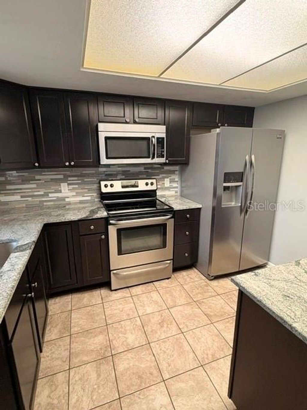 Photo of 4014 Ashford Green Place #G202, Tampa, FL 33613 (MLS # TB8509153)