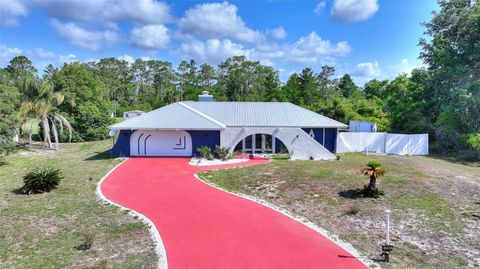 Photo of 3850 Park Avenue, Indian Lake Estates, FL 33855 (MLS # P4938576)