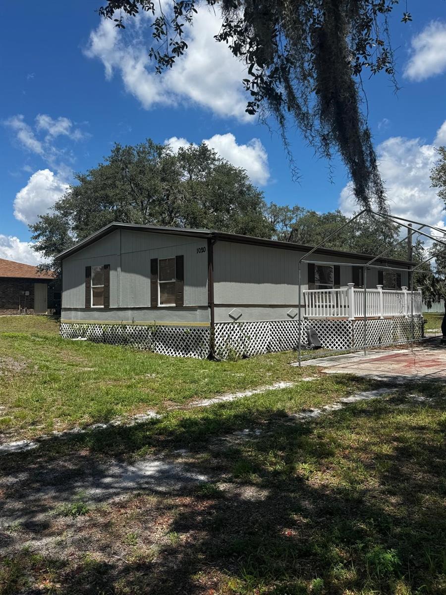 Welcome to 1020 US Highway 98 W in Frostproof, Florida — a spacious 3-bedroom, 3-bath double-wide mobile home nestled on a full 1-acre lot with no HOA! With approximately 1,600 square feet of comfortable living space, this home offers a rare combination of open land, interior space, and lifestyle flexibility. The open-concept floor plan creates a seamless flow between the living room, dining area, and kitchen, making it perfect for entertaining or enjoying quiet evenings at home. Each bedroom is generously sized and features its own bathroom, offering privacy and convenience — ideal for families, roommates, or guests. A water softener system is already in place, providing added efficiency and comfort. The acre lot provides plenty of space for outdoor activities, gardening, RV or boat parking, or even adding a workshop or storage shed. Located just minutes from downtown Frostproof, this property combines peaceful rural living with convenient access to nearby amenities and scenic lakes. Whether you’re looking for your primary residence or a smart investment in Polk County, this home offers incredible potential and room to grow. Don’t miss your chance to own a full acre with a move-in-ready home in a quiet, country setting!