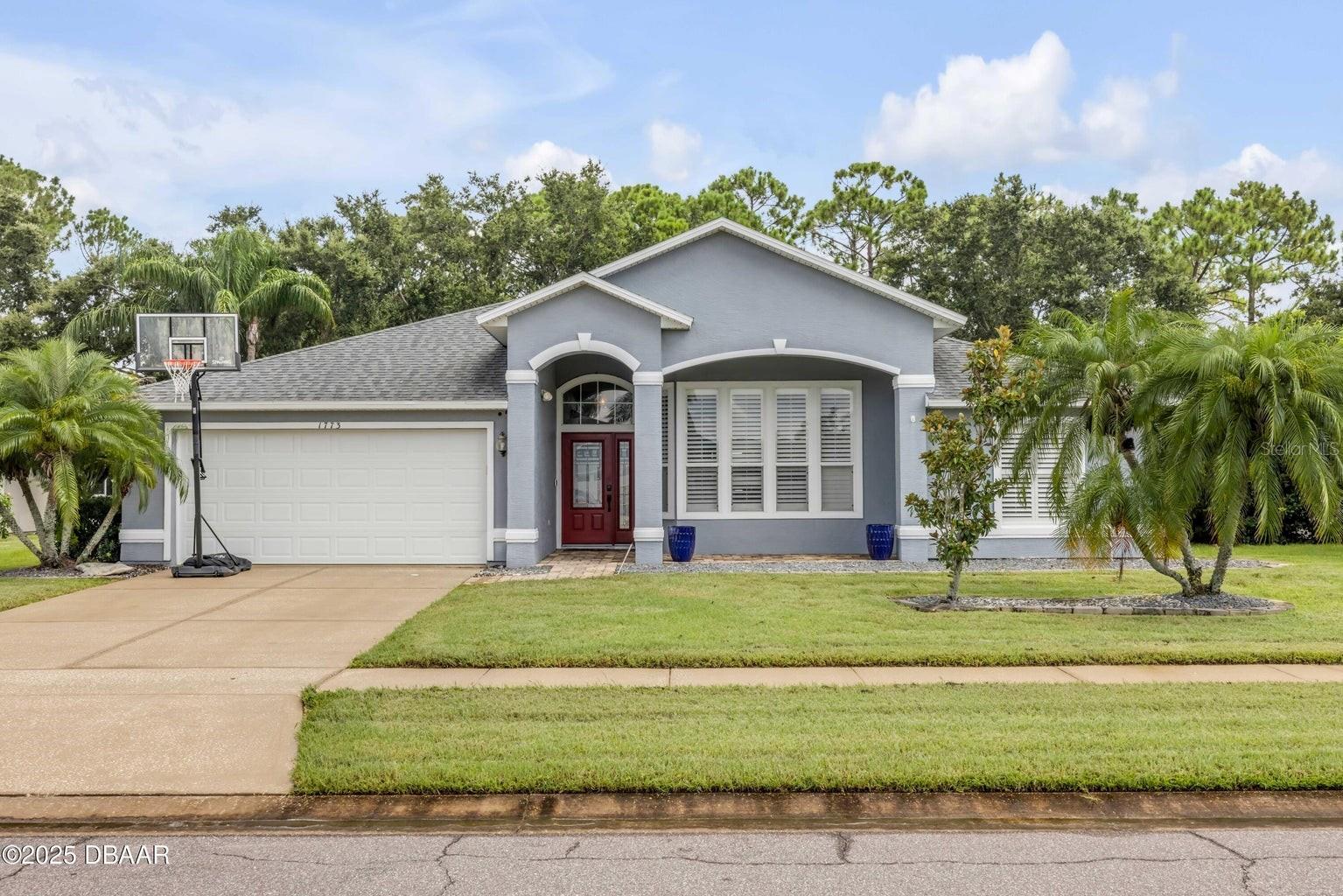 Welcome to this beautifully upgraded 4-bedroom, 2-bath pool home in the desirable Water's Edge community. This home features a spacious split floor plan with tile flooring throughout, plantation shutters, and an electric fireplace. The kitchen is a chef’s dream with quartz countertops, custom wood cabinetry, tile backsplash, and stainless steel appliances. The large master suite offers a walk-in closet, additional storage, and a luxurious bath with dual vanities, soaking tub, and walk-in shower. Enjoy outdoor living in the screened-in chlorine pool (resurfaced 2017) with pavered deck and fenced backyard overlooking peaceful views. Roof (2017), A/C (2017), Water Heater (2022). Located near top-rated schools, shopping, and dining. Don’t miss this move-in-ready home—schedule your showing today!