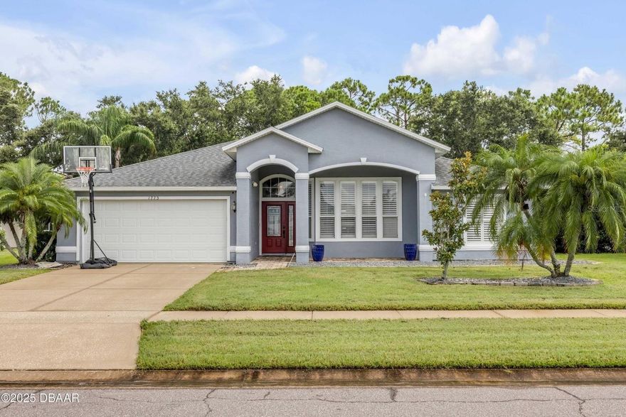 Welcome to this beautifully upgraded 4-bedroom, 2-bath pool home in the desirable Water's Edge community. This home features a spacious split floor plan with tile flooring throughout, plantation shutters, and an electric fireplace. The kitchen is a chef’s dream with quartz countertops, custom wood cabinetry, tile backsplash, and stainless steel appliances. The large master suite offers a walk-in closet, additional storage, and a luxurious bath with dual vanities, soaking tub, and walk-in shower. Enjoy outdoor living in the screened-in chlorine pool (resurfaced 2017) with pavered deck and fenced backyard overlooking peaceful views. Roof (2017), A/C (2017), Water Heater (2022). Located near top-rated schools, shopping, and dining. Don’t miss this move-in-ready home—schedule your showing today!