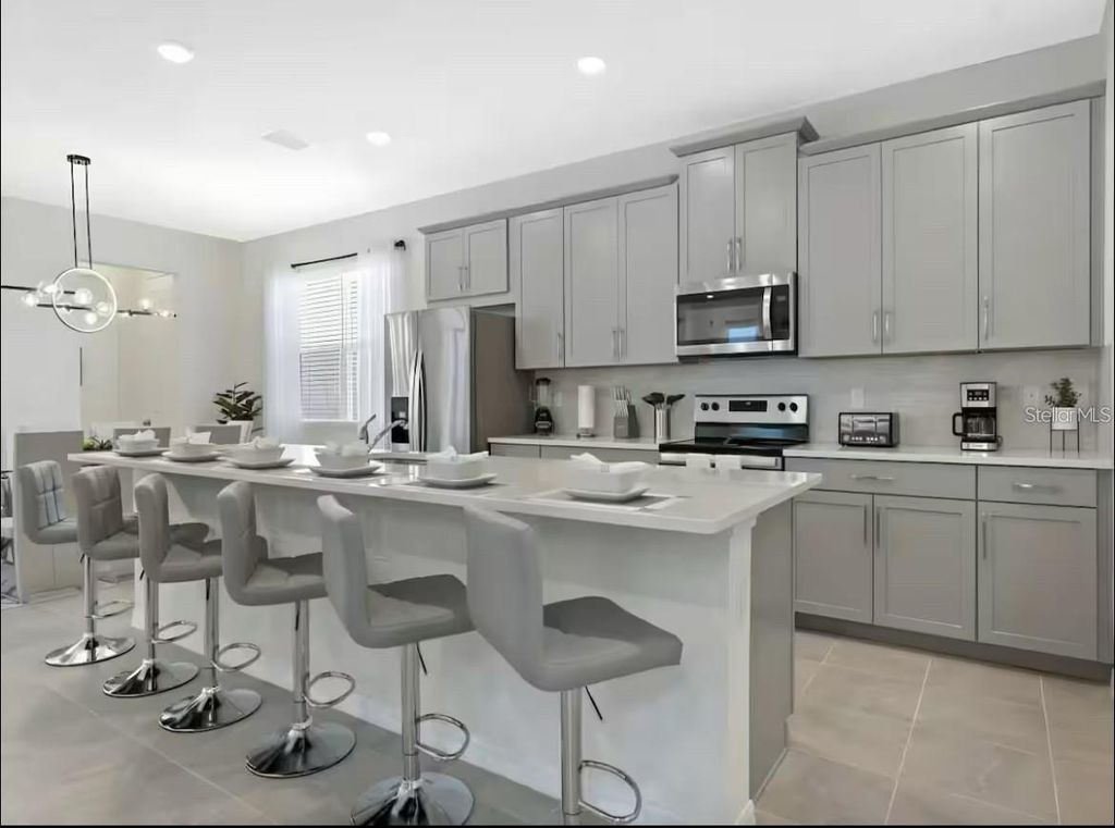 Photo of 1929 Tropical Palms Circle, Kissimmee, FL 34747 (MLS # O6395222)