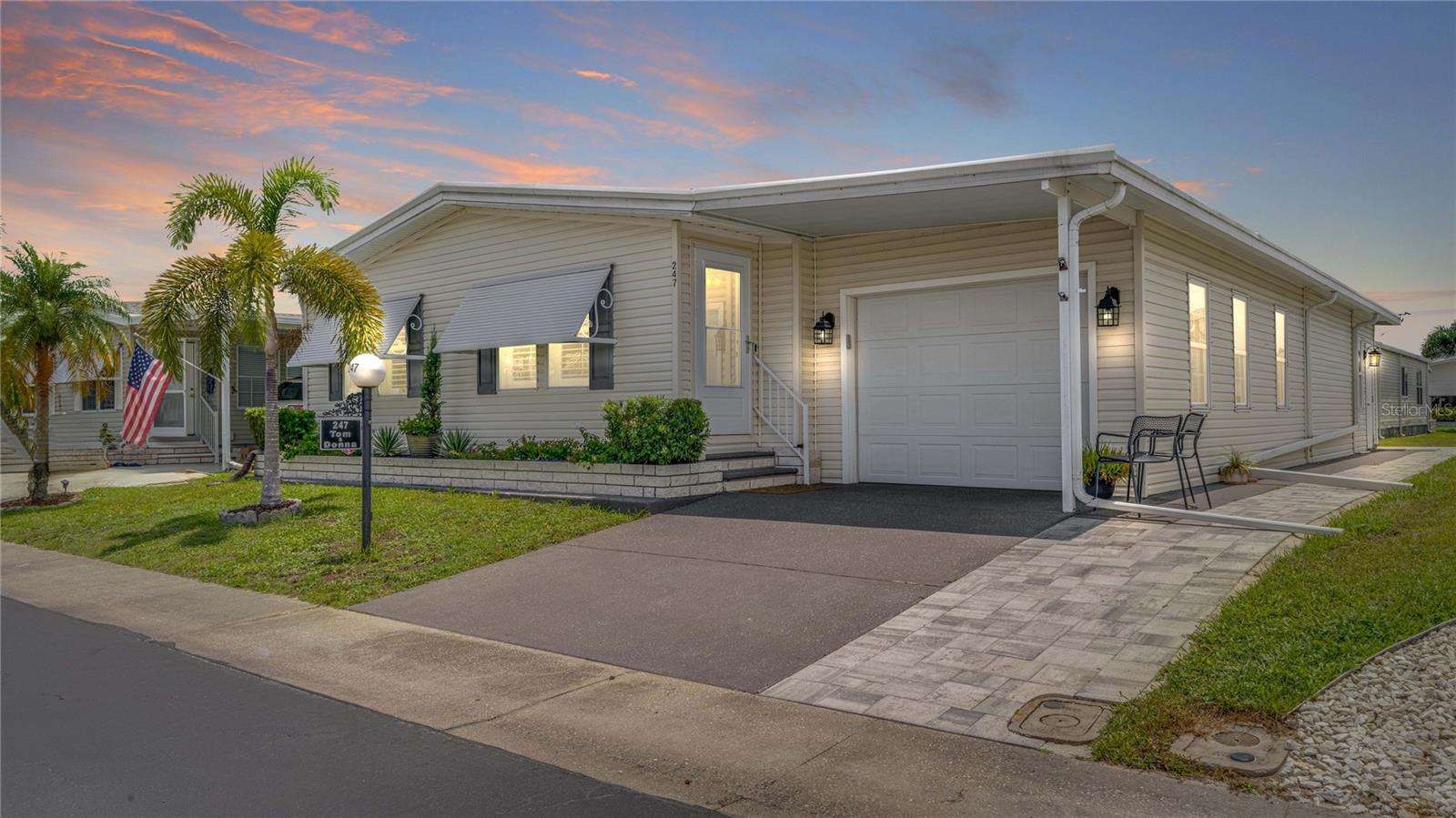 Charming 2-Bedroom, 2-Bath Manufactured, Garage Home in Horizon Village | An Extraordinary & Affordable Dream Home | North Fort Myers, Florida - This spacious manufactured home, boasting approximately 1,900 SF, offers much more than two bedrooms. Bonus and flex space abound and will readily accommodate your lifestyle; your needs and wants, while providing luxury, comfort and style.
New residents will be taken aback by a stunning 20' x 10' kitchen. The designer LX quartz countertops, stainless appliances, built in lighted cabinetry, and an eat-in breakfast area, make it the perfect spot for casual dining. New light fixtures, and the recently installed Fandelier, reflect the taste and style of the current owners. Two pantries? Of course!
The expansive living room, dining area, and family room are ideal for entertaining or relaxing. There is also ample room for a home office, craft space, or a reading nook; perhaps a den, as both lanai areas are tastefully finished and air-conditioned, providing additional living space to enjoy year-round. The possibilities are endless. The choices are yours.
The 20' x 13' master bedroom is a retreat. The en suite bathroom, as well as the guest bathroom, have been enhanced and updated with Cambria quartz.
Additional Upgrades & Enhancements Include: AMS Roof – 2023 (Transferable Warranty) | AC – 2024 | Hot Water Heater – 2020 | Repiped – 2020 | Fresh Landscaping – 2025 | Brick Paver Golf Cart Pad & Patio - 2025 | Storm Door – 2024 | Bluetooth Garage Door & Springs – 2025 | Inside Laundry - Newer Appliances | Freshly Painted | Finished Decorative Driveway
Don't miss your chance to own this exceptionally well-maintained home in a warm and welcoming 55+ community rich with amenities. Shares valued at $100K are included in the sale price. HOA Fees - $300 Month. No Flood Zone | No Ground Rent. Schedule your showing today!