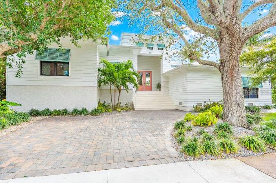 Location, Location, Location .... Steps from Saint Armands Circle and walking distance to Lido Key Beaches. Move - In ready, Absolutely NO hurricane damage or flood damage from past hurricanes. Welcome to 328 Monroe Drive- This spacious one story home offers luxury and coastal living with the most unique and relaxing pool on the island. The home was built in 2020 on a sprawling double lot, a 14,875 SqFt property. This rare 8 bedroom/ 8 bathroom home spans just shy of 4,000 SqFt, can be used a high income producing weekly vacation rental, and is being offered fully furnished. As you step inside, you will notice the impressive entryway and the brightness of natural light filling the open floor plan. The gourmet kitchen is a culinary enthusiast's dream with its spacious layout, natural light, premium appliances, and double ovens for an epicurean delight. The primary bedroom ensures a pampered experience with its stunning ensuite and walk-in closets. Additional comforts are its romantic fireplace and high vaulted ceilings, which provide a beautiful touch to the interiors. Outside, the property offers a bespoke outdoor lifestyle with a large yard, custom luxury swimming pool including barstool and island seating, a large covered back patio and outdoor kitchen for entertaining, and a hot tub - turning weekends into a vacation. Additionally, the home is nestled in a highly popular neighborhood, within a very short stroll to world renowned shopping and dining at Saint Armands Circle , walking distance to Lido Key Beaches, adding to the convenience of luxury living. This single-story home is a blend of luxury, comfort, and compatibility with modern finishes, making it a truly unique property. Immerse yourself in the allure of Sarasota's spectacular landscapes right from the comfort of your home. Seize this fantastic opportunity to call this splendid home yours.