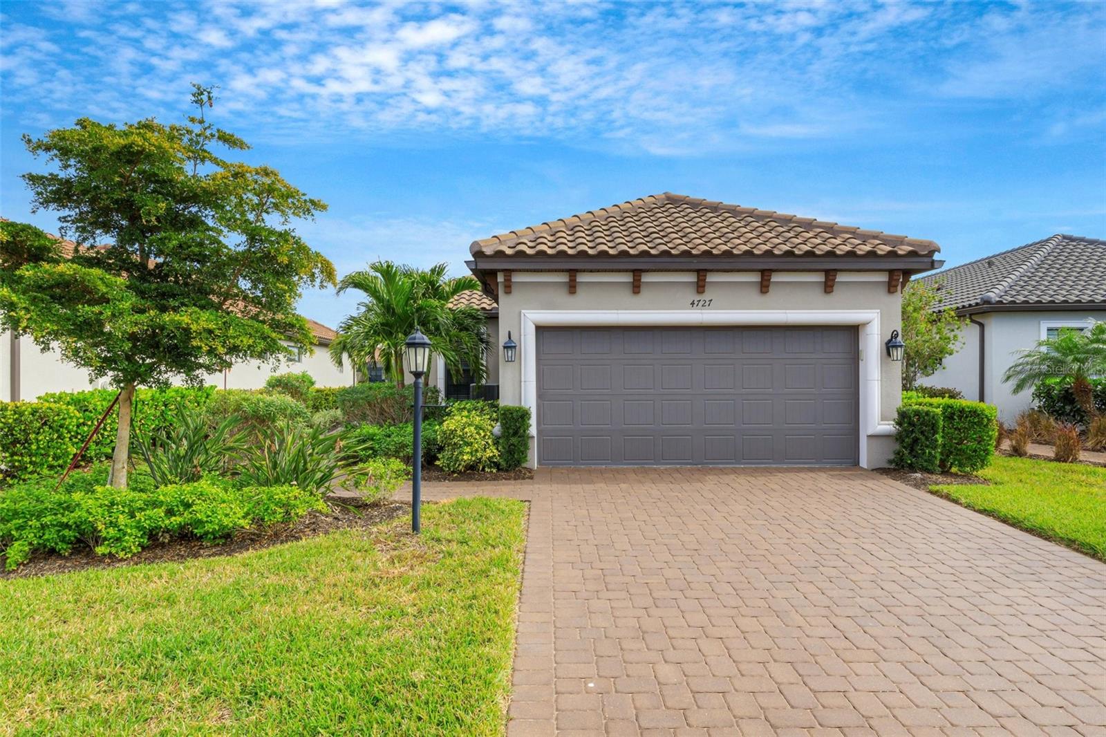 OUTSTANDING NEW PRICE .......Discover this Roma model home situated on a GOLF DEEDED homesite with a beautiful lake view. This residence features two comfortable bedrooms and a dedicated office/den, making it the perfect retreat. It is move-in ready and boasts ceramic wood tile flooring. The home has been upgraded with high tray ceilings and 8-foot doors, along with a spacious laundry room.
Included in the sale are ceiling fans, TVs, and window treatments. The gourmet kitchen is equipped with upgraded appliances and wood cabinets.
Additional features include a gas water heater and an AC UV light system. The epoxy-coated two-car garage has an extra four-foot extension for additional storage. The lanai is equipped with a motorized hurricane screen for protection during high winds.
Located in the highly sought-after Esplanade at Azario community in Sarasota/Manatee County, this home offers all the amenities of a golf resort. Enjoy an outstanding golf course, aqua range, short game area, and putting green. For sports enthusiasts, there are several courts for tennis, pickleball, and bocce.
Indulge in the newly opened Culinary Center, which spans approximately 15,000 square feet and is designed to provide world-class culinary experiences. The Wellness Center offers spa services managed by professionals and includes nutrition and fitness consultants. You can also enjoy luxurious spa packages that include massages, body treatments, skincare, manicures, and pedicures, along with wellness programs and various fitness and aquatic classes.
The Bahama Bar features a full-service bar and restaurant, delivering an authentic resort experience just steps from home. Residents of Esplanade at Azario Lakewood Ranch can unwind by a fire pit, savor a drink and a meal, and enjoy the stunning views of this beautiful outdoor space, conveniently located just a short distance from the pool.
Schedule your tour today!