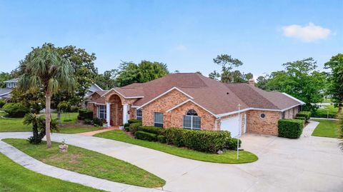 Photo of 766 Pelican Bay Drive, Daytona Beach, FL 32119 (MLS # O6410354)