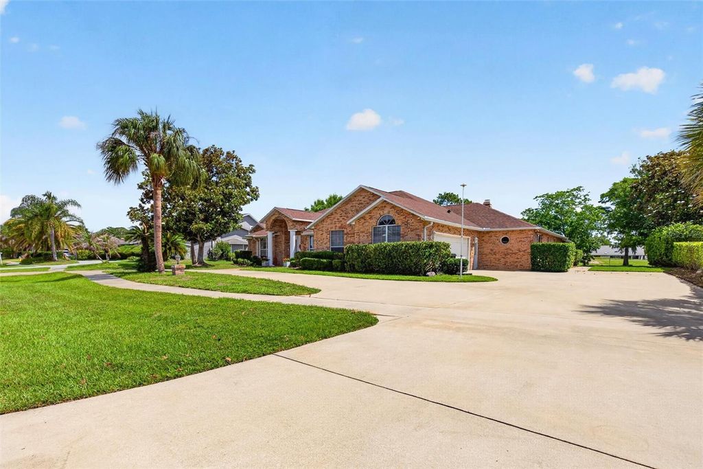 Photo of 766 Pelican Bay Drive, Daytona Beach, FL 32119 (MLS # O6410354)