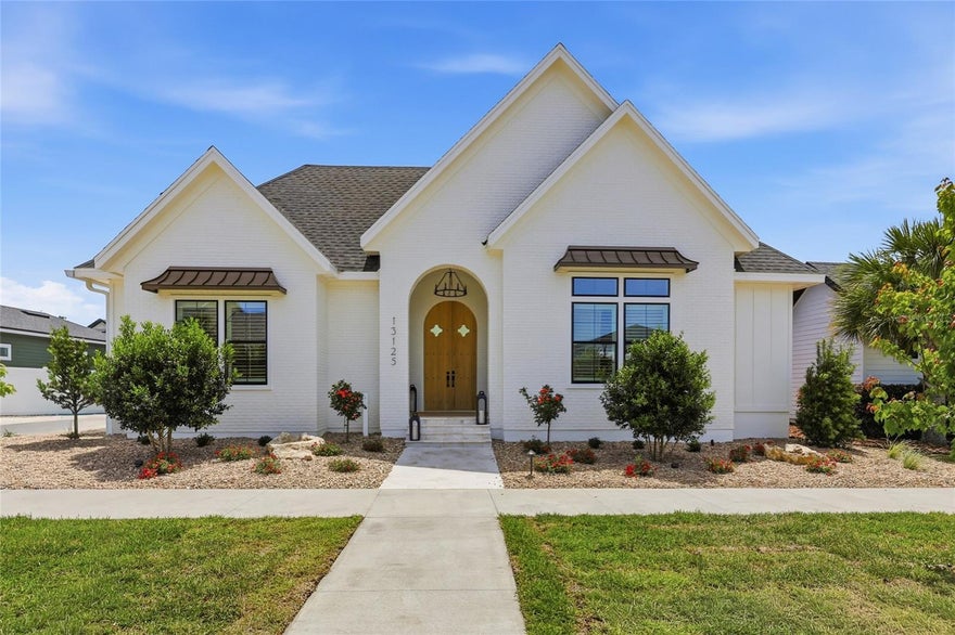 A Spring Parade 2026 Pridgen Showstopper. A home that feels collected over time, where beauty, function, and ease come together for everyday living and memorable entertaining.

Centered around a private courtyard pool, the home is designed for seamless indoor-outdoor living—sunlit interiors open to expansive entertaining spaces and a welcoming porch, creating a natural rhythm for both quiet mornings and lively gatherings. The outdoor experience is elevated with a cypress pergola, summer kitchen, travertine surfaces, and striking Sylvester palms that frame the setting beautifully.

Classic architectural elements and tailored finishes bring depth and character throughout, including heavily distressed beams, arches carried seamlessly through main living and tiled spaces, and a gas fireplace with stucco brick detailing flanked by custom built-ins. Be sure to notice the two hidden closet entrances discreetly tucked behind paneled walls—an unexpected and thoughtful design feature that enhances both charm and functionality.

The layout offers exceptional versatility with a private in-law suite for guests, a serene primary retreat with an adjoining office, and a spacious game room for gathering and relaxation. A steep front elevation adds to the home’s commanding presence and timeless curb appeal. Each space is intentionally designed to feel both connected and distinctly its own.

Residents of Town of Tioga enjoy a host of community amenities including a pickleball court, clubhouse, pool, playground, tennis courts, sand volleyball, basketball courts, and scenic walking trails. Tioga Town Center is just steps away with fine dining, boutique shopping, and Gainesville Health and Fitness. Conveniently located approximately 4 miles from I-75, 4.5 miles to North Florida Regional Medical Center, 8 miles to the University of Florida, and 11 miles to Shands Hospital, this home offers luxury, comfort, and accessibility in one exceptional package.