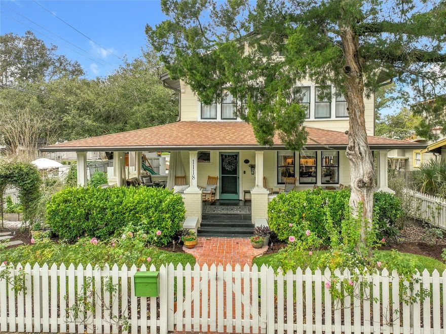 Welcome to 1118 S Park Avenue, a beautifully restored circa-1916 Craftsman on a corner lot in Sanford’s Residential Historic District. Just moments from First Street and Sanford Avenue and located within the coveted golf cart zone, this home offers walkable access to downtown dining, shops, events, parks, and the waterfront.

A classic wraparound front porch framed by a white picket fence sets the stage for timeless charm. Inside, refinished heart pine hardwood floors, French doors, decorative windows, custom window treatments, and a natural gas fireplace create a warm and inviting atmosphere. The living and dining areas flow effortlessly and feature a custom mantle, built-in storage, and a dining room wet bar with marble backsplash, antique seeded glass cabinetry, copper sink, beverage refrigerator, and wine fridge, ideal for entertaining.

At the heart of the home, the fully redesigned chef’s kitchen blends craftsmanship and functionality with custom cabinetry, white oak shelving, a custom plaster range hood, reclaimed heart pine flooring, a hidden walk-in pantry, and a premium Bosch appliance suite including an induction range and double ovens. Just off the kitchen, a well-designed mudroom offers laundry, storage, and a convenient drop zone with access to the half bath and backyard.

The first-floor primary suite provides privacy and direct access to a wood deck, perfect for morning coffee or evening relaxation. The primary bathroom has been completely redesigned with custom cabinetry and dual independent shower heads, surrounded by thoughtfully planned native landscaping. Upstairs are three additional bedrooms, a bonus room, and beautifully updated bathrooms, including a hall bath with an iron clawfoot tub and penny tile. A dedicated upstairs office features custom built-in bookshelves with library lighting.

Extensive renovations were completed with care for historic integrity, including complete permitted replumbing and full electrical rewire of the entire home, dual HVAC systems with smart thermostats, a tankless natural gas water heater, restored original windows with historically appropriate replacements, a 2020 architectural shingle roof, enhanced attic insulation and storage with pull down stairs, lighting, and ventilation, and professionally installed drainage directing all water to the street.

Outdoor spaces are equally impressive, with Florida friendly landscaping designed alongside a Florida Master Gardener and native plant experts. Features include raised garden beds, crushed shell paths, drip irrigation using reclaimed water, premium low voltage lighting, a side yard play space with Delaturf artificial turf, a permitted 10x10 shed, and alley access garage. A transferable termite bond is included.

Rich in history and once known as the Celery House Inn, this exceptional home offers a rare opportunity to own a beautifully preserved piece of Sanford’s past, thoughtfully updated for modern living.