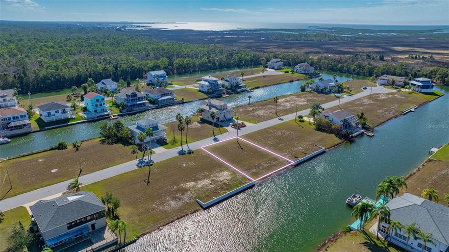 Come Build your dream home in Hernando Beach South! This waterfront lot is 7500 SF! The $330 annual Homeowners Association fee includes lawn maintenance until your new home is constructed and access to the community boat ramp. NO SHORT-TERM RENTALS ALLOWED in Hernando Beach South. Hernando Beach is a charming waterfront community located in Hernando County, Florida. Known for its serene atmosphere and stunning views, this area is a popular destination for those seeking a relaxed coastal lifestyle. Situated along the Gulf of Mexico, Hernando Beach offers a variety of waterfront properties, including single-family homes, and vacant land. Many of these properties feature private docks and boat lifts, allowing residents to easily indulge in boating, fishing, and other water activities. In addition to its waterfront appeal, Hernando Beach boasts a range of amenities and recreational opportunities. The nearby Weeki Wachee Springs State Park provides opportunities for kayaking, paddleboarding, and even swimming with manatees. For those who enjoy golfing, Hernando Beach is in close proximity to several golf courses, offering scenic fairways and challenging play. The community is also home to a variety of restaurants, shops, and entertainment options, ensuring residents have everything they need within reach. With its picturesque surroundings, waterfront access, and convenient amenities, Hernando Beach is a sought-after location for those looking to embrace the coastal lifestyle. Don't miss out on this incredible opportunity to own a piece of paradise! Embrace the waterfront lifestyle you've always dreamed of and make this land your own. Contact us now to schedule a viewing and start planning your coastal masterpiece. Water, sewer, and power connections are located at the street. Property is located in a flood zone so any home constructed will need to be elevated. R1B zoning for a single-family home. Lot is across the street between 3408 Jewfish Dr. and 3424 Jewfish Dr. (Please note that lot lines shown on aerials are approximate.) Land financing options available, please ask the listing agent for details.