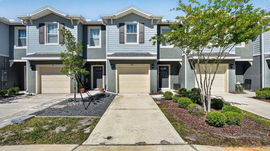 Welcome to this beautifully designed Bella Lago townhome in the highly desirable Bella Oaks community of Port Orange, offering modern, low-maintenance living in one of the area's most sought-after locations. This popular 2-bedroom, 2.5-bath townhome with over 1,600 square feet delivers the perfect blend of space, style, and functionality--ideal for primary residence, second home, or investment opportunity. Step inside to an inviting open-concept floor plan featuring a spacious living and dining area that flows seamlessly into a contemporary kitchen with quartz countertops, stainless steel appliances, center island, and abundant cabinet space--perfect for everyday living and entertaining. Large sliding glass doors open to a private patio overlooking peaceful water views, where you can unwind and enjoy stunning Florida sunsets.

Upstairs, enjoy a thoughtfully designed split layout with two oversized primary suites, each complete with private en-suite bathrooms and walk-in closets, offering flexibility for guests, roommates, or a comfortable work-from-home setup. A convenient half bath on the main level adds ease for visitors.

Additional highlights include tile flooring on the main level, plush carpeting upstairs, energy-efficient construction, smart home features, a one-car garage, and driveway parking.

Located just minutes from top-rated schools, shopping, dining, medical facilities, and a short drive to Daytona Beach and the Intracoastal Waterway, this home offers the perfect combination of convenience, comfort, and lifestyle.

Don't miss your opportunity to own a move-in ready townhome in Port Orange with water views--schedule your private showing today.