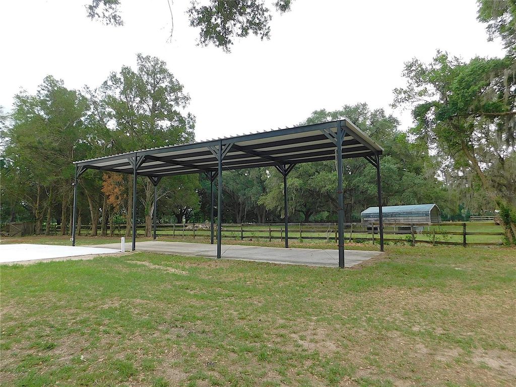 Photo of 6875 NE 25th Avenue, Ocala, FL 34479 (MLS # OM724465)