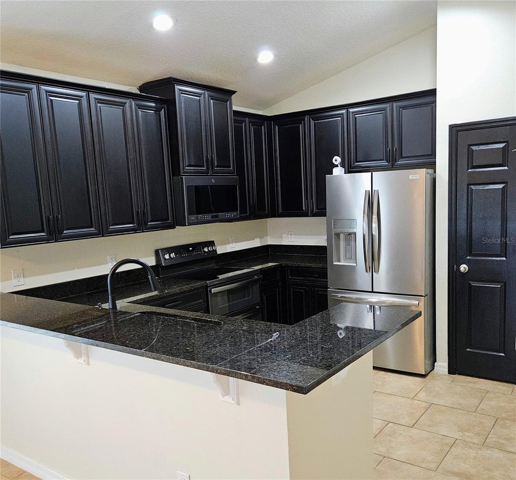 Photo of 316 Andalusia Loop, Davenport, FL 33837 (MLS # P4938961)