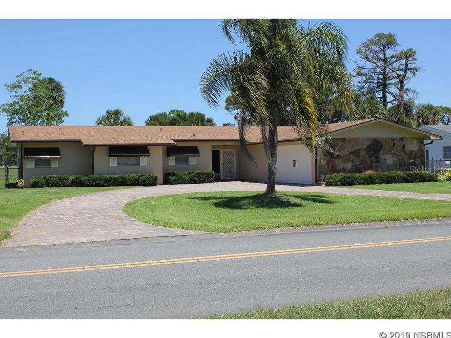 eautiful and spacious 4 bedrooms / 2.5 baths home located on New Smyrna Beach golf course.Features include hardwood floors in the dining room, bedrooms, and hallway. Tile in foyer.  Newcarpet in living room and family room.  New paint inside and outside of house.  All new light fixturesand ceiling fans.  Relax on the large patio that overlooks the golf course.  The electrical panel is new.The irrigation system was updated with new timing unit.  Double car garage with an extra storageroom.  A new fence was put in around large backyard.  Centrally located in a desirable neighborhoodand only a short drive to beach and parks. ;Water: City
