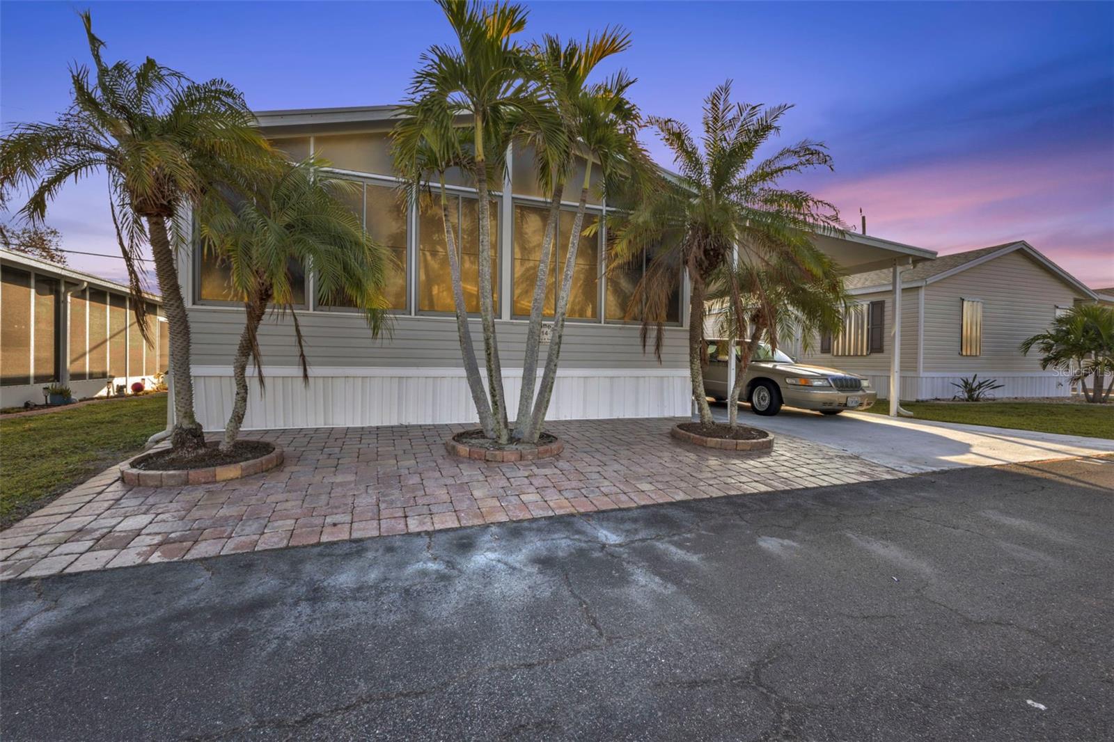 2006 DOUBLE WIDE manufactured home in popular River Haven Community a 55+ across the street from the Burnt Store Publix shopping
center including Home Depot, Publix, Pet Superstore, Shipping Store and so much more! VERY CONVENIENT TO ALL AMENITIES including
Walmart and just minutes to the 1-75 exit so you can get where you need to go quickly. **OWN YOUR OWN LAND** LOW HOA! NEWER ROOF (2021) AND A/C WAS REDONE IN 2019. Open concept layout with kitchen at the heart of the home featuring a kitchen island and plenty of cabinet space. MOST FURNITURE INCLUDED, ALL APPLIANCES INCLUDED. 2 full beds and 2 full baths. ESCAPE TO YOUR OWN WINTER RETREAT WITH THIS AFFORDABLE HOME! Large outside screened lanai with 1 - car carport and storage shed + additional FLORIDA ROOM AT FRONT OF THE HOME! THE LAUNDRY ROOM IS INSIDE FOR YOUR CONVENIENCE. River Haven is one of the prettiest parks in the area AND HAD NO FLOODING DURING ANY OF THE STORMS. The community offers their residents a host of amenities including a HEATED AND CAGED COMMUNITY POOL, clubhouse, marina with docks, park area, shuffleboard courts, and a boat storage area. Just a short drive from Historic Downtown Punta Gorda, where there are weekly farmer's markets, fine and casual dining including waterfront dining, miles of biking paths and FISHERMEN'S VILLAGE WATERFRONT MALL! There are many social events to keep you as engaged as you'd like to be. LOW HOA FEE IS ONLY $250/MO AND INCLUDES LAWN MOWING! With low fees and a welcoming community atmosphere, now is the perfect time to secure your winter retreat! Buyer must be interviewed and approved by the Board. Land is resident-owned and requires a 10-share purchase for $10,000 WHICH IS REFUNDABLE WHEN YOU SELL. Call today for a private showing and community tour!