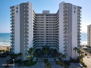 Welcome to this large fully furnished Oceanfront condominium ready to be your beautiful beach retreat. This 3 bedroom 3 bathroom has an open floor plan and large kitchen. Oversize master bathroom features a stand up shower and a separate garden tub. Wood Shutters adorn the windows. Luxury vinyl throughout. Hurricane shutter on exterior windows and sliders. The 40 foot long balcony across two bedrooms and living area overlooking the ocean, is the ideal location to enjoy sunrise & moon settings. Club room features a library, piano, pool table, full bar, kitchen, and large TV. Gym, Underground assigned & secured parking.