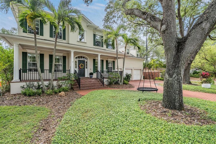 Nestled on a generous lot with a brick paved circular driveway and a 3-car garage, this 4,643 sq. ft., 5-bedroom, office/den, 4.5-bathroom custom-built home on sought-after Davis Islands. As you step inside, you'll be captivated by the refined elegance of hardwood flooring, crown molding, and a formal dining room accented with chair railing.

The gourmet kitchen boasts a 6-burner Viking gas range, two Viking double convection ovens, built-in microwave, quartz countertops, and a subzero side-by-side refrigerator. The butler's pantry, complete with a wine fridge and two walk-in pantries, offers ample storage. Designed for entertaining, the kitchen seamlessly connects to the family room, which features a cozy fireplace and French doors that open onto a brick paver-covered porch.

The main level also includes a sophisticated office with French doors, a charming library area with floor-to-ceiling custom bookshelves, and a versatile mudroom, perfect for pet owners or hobbyists. Upstairs, the master retreat offers a sitting area, two walk-in closets, and a luxurious bathroom with dual vanities, a walk-in shower, and a soaking tub. The second bedroom has an en suite bathroom and walk-in closet, while bedrooms three and four share a Jack & Jill bathroom with dual vanities, a private shower/bath, and walk-in closets.

The impressive fifth bedroom doubles as a bonus room with a custom barn door entry, en suite bathroom, and expansive private living space. Rounding out the upper level is a convenient laundry room, located near all bedrooms. **Home was revamped/redone in 2019 upstairs, downstairs, inside, and outside... MORE RECENT ADDITIONS: BRAND NEW ROOF, WHOLE HOUSE GAS GENERATOR AND NEWER AC SYSTEMS**