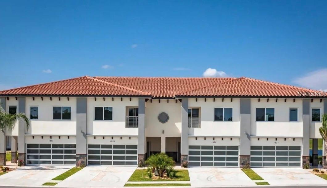 Contemporary 4 bedrooms 3.5 bathrooms Townhome with a lot of upgrades in Golf Club Villas a luxury GOLF COURSE COMMUNITY. This modern townhome design features a 2-story concrete block construction, tile roof, 2 car garage with frosted glass garage doors. Waterproof Luxury Upgraded Vinyl flooring throughout first floor. Stainless steel grade cable railing on interior stair system. Custom doors with horizontal aluminum strips with lever handle on interior doors. Solana 48” nickel brushed ceiling fans with opal frosted glass lighting in all bedrooms and living room. Designer contemporary style chandelier with matching dining room and island light fixtures and much more!! Downstairs you are welcomed by an open floor plan with lots of light, a full 1 bedroom suite with an ensuite bathroom, a half bathroom, pantry and store area. Kitchen is also very modern and features a waterfall granite countertop, marble backsplashes, Elegant 42” multi-leveled Euro-design cabinetry with soft open and slow close feature, Frosted glass cabinet door with interior LED cabinet lighting, Gourmet kitchen and built-in stainless steel appliance package with micro-wave oven combo, cooktop, range hood, dishwasher and counter-depth fridge with ice maker, Built-in 36 bottle wine cooler, Designer faucet with pull-out spray. Pine wood 5 ¼” crown molding and baseboards painted and installed in all rooms. Upstairs you are welcome by a nice size loft. The Master bedroom has a tray ceiling with LED lighting and a stunning balcony to enjoy the views. The ensuite Master bathroom is stunning and spacious with a stand alone tub, granite counters, under cabinet LED lighting, double sinks, tile shower and walking closet. Remaining two bedrooms are also super spacious and share an additional bathroom with full shower and double sinks. The townhome development in Providence Golf and Country Club are featuring 18-hole designer Golf Course by Michael Dasher, located just 15 minutes from Disney and main attractions. Other Providence amenities include Dog Park, Bar/Restaurant, Clubhouse, Zero Entry Pool with Slides, Jr Olympic Lap Pool, Fitness Center, Tennis Courts, Playground and much More. NO CDD, LOW HOA!, Construction warranty by 2-10 Home Builders.