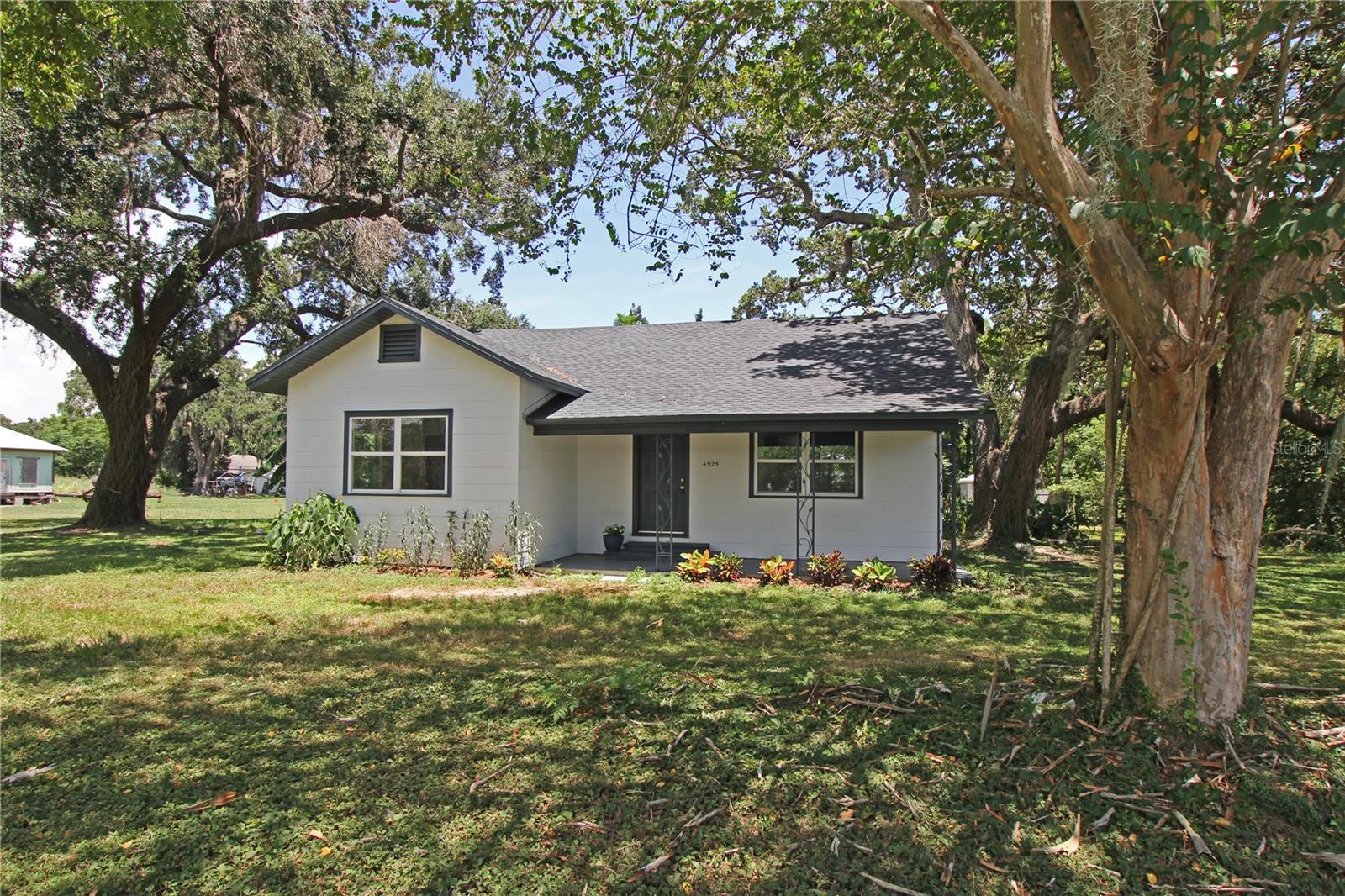 Charming 1920s home that has been beautifully renovated.
- Features 3 bedrooms and 2 bathrooms
- Spacious 1,334 square feet
- New vinyl flooring throughout
Includes a dedicated laundry room.
Set on a generous .69 acres with no HOA, this property offers a serene environment.
Meticulously updated with modern amenities, this home showcases a brand-new electric tankless water heater and updated light fixtures. The exterior highlights a new roof, fresh paint, plus a new well pump and tank. Close to State Road 37, State Road 60 and Interstate 4. A short ride to restaurants, shopping and services in Mulberry and Lakeland.