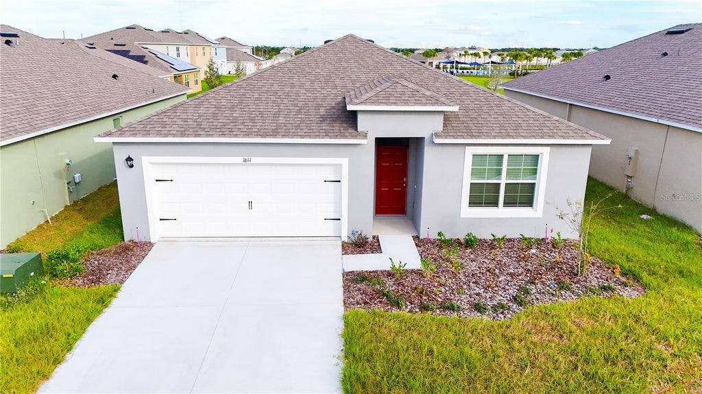 Photo of 1811 Silverbell Loop, Haines City, FL 33844 (MLS # O6434853)