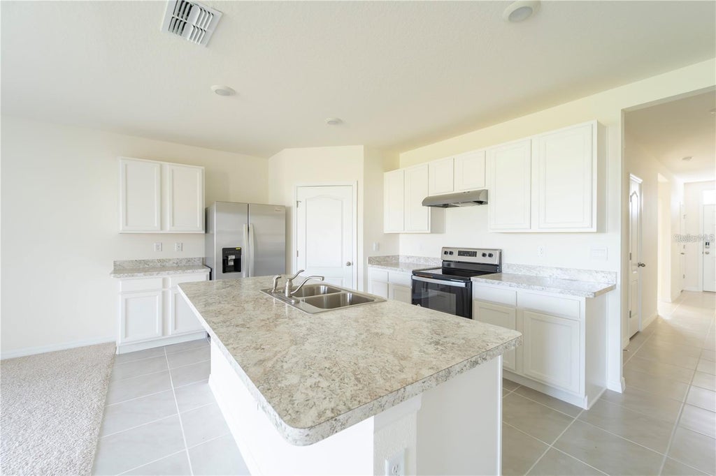 Photo of 1811 Silverbell Loop, Haines City, FL 33844 (MLS # O6434853)