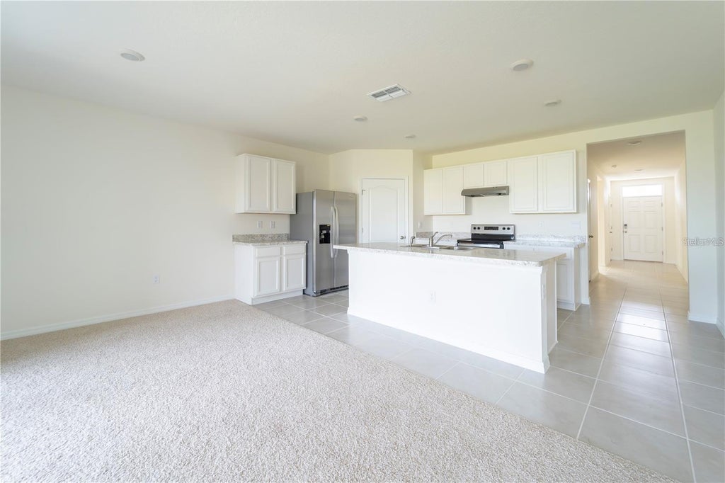 Photo of 1811 Silverbell Loop, Haines City, FL 33844 (MLS # O6434853)