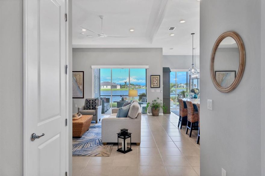 Life and work changes are relocating sellers out of state! The sellers love this home on a corner lot as it has the advantage of providing more yard space and only one direct neighbor. Lot depth is 130ft and offers adequate space for a pool. The combination of a corner lot and lush landscaping contributes to a sense of seclusion and privacy, making this home more desirable for those who value quiet and peaceful living. Discover the ultimate retirement dream at Del Webb Bay View, where an exceptional 2-bedroom plus den home awaits you. Situated in an exclusive 55+ community, this residence offers an active and social lifestyle, coupled with magnificent water vistas. Inside, an open and airy layout welcomes you, with the den offering versatility for your needs. Large windows bathe the living spaces in natural light, and a spacious lanai presents unobstructed water views that inspire serenity. Del Webb Bay View is your gateway to a fulfilling, age-in-place lifestyle, where each day brings new opportunities for leisure and community engagement. Step into this modern home that's sure to impress with its trendy two-toned culinary center, featuring a spacious quartz-topped island. Storage abounds in this well-designed space; the lower kitchen cabinets come with convenient pull-out drawers, the pantry is elegantly fitted, and there's even an extra closet in the kitchen with electric, perfect for a wine room. The half bath has been tastefully finished with shiplap and a stylish vanity. You'll find not one, but two primary closets, one professionally finished, and the other serving as a bonus storage area. The oversized primary bedroom boasts a luxurious bath with quartz-topped dual sinks, a walk-in shower with a bench, a linen closet, and a water closet.
However, the heart of this home is the Gathering room, Café, and Kitchen. The extended, 20/20 screened lanai fulfills all your Florida living desires. This energy-efficient Prestige home is equipped with a tankless hot water heater, water softener, and water filtration system. A comprehensive list of upgrades and finishes is available. Del Webb Bay View is a registered 55+ Gated community, with the HOA payment covering Spectrum high-speed internet, live-stream television, lawn and tree maintenance, and mulching. The community takes care of irrigation, but a small non-potable water fee from Manatee County applies.
Location? You're in close proximity to world-class dining, shopping, arts and cultural events, fishing, boating, and just a short drive to St. Pete and Anna Maria Island Beaches. Plus, with Tampa, Clearwater, and Sarasota airports all less than 45 minutes away, travel is a breeze.