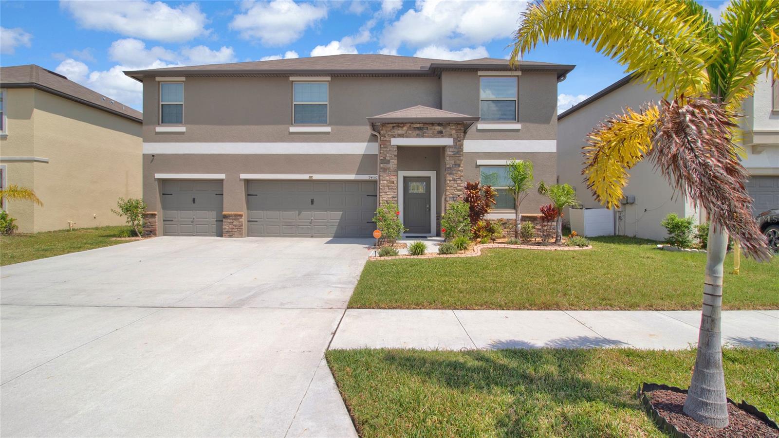 Unique and the only House with this floorplan on this Community - Welcome to this spacious 6-bedroom with a Den and a Gym room and 4 Full Bathrooms, a 2-story home with 3-car garages located in the Belmont community. Just off Apollo Beach Exit. Designed with an open-concept layout, the kitchen seamlessly overlooks the living and dining areas, as well as the outdoor open patio, perfect for relaxing or entertaining with a 17x40 covered-screened Lanai, with a stunning pond view and a Heated Swim Spa. All fenced in. The kitchen is a chef's dream, featuring an oversized island, pantry, all-wood cabinetry, quartz countertops, and a full suite of stainless-steel appliances including a gas range, microwave, dishwasher, and side-by-side refrigerator. Reverse Osmosis included. 1 bedrooms on the 1st floor for guests and a Full bathroom. The other 5 bedrooms are on the 2nd floor. The large primary bedroom is overlooking the pond with 2 walk-in closets, separate sinks, cabinets for his and hers, a shower, and a separate garden tub. The other 4 bedrooms are a nice size with 2 additional full bathrooms, both with Double sinks. Additional highlights include a laundry room with a full-size washer and dryer, a loft area, and a Gym Room. The 3-car garage has an Electric Vehicle charger. Enjoy all that the Belmont community has to offer, including a resort-style pool, clubhouse, playgrounds, dog park, and peaceful walking trails. Conveniently located near top-rated schools, hospitals, shopping, dining, and with easy access to the interstate for commuting.. Don't miss this opportunity to live in comfort and style. Schedule your showing today!