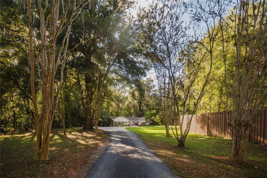 Beautiful 4 Bedroom, 3 Bath Home with Breathtaking Possum Creek Views – Available December 2025
Experience the perfect blend of comfort, space, and natural beauty in this stunning 4-bedroom, 3-bath home nestled on 1.39 acres overlooking the serene Possum Creek.
Step inside to find a spacious great room with soaring wood-beamed ceilings and multiple sets of glass doors that open onto multi-level decks, perfect for relaxing or entertaining while taking in the incredible creek views.
The large kitchen and dining area offer plenty of room for gatherings with family and friends, complemented by abundant natural light pouring in through expansive windows and French doors.
A beautiful glass library/music room provides the flexibility to serve as a fourth bedroom, home office, or creative space.
The master suite features a screened porch overlooking the creek and a private sitting area ideal for an office or reading nook. One of the additional bedrooms includes its own bathroom and private entrance to a charming brick patio sitting area.
The lower level offers a versatile bonus space—perfect for a media room, playroom, or home gym.
Located just minutes from the University of Florida, downtown Gainesville, shopping, and restaurants, this home offers both convenience and tranquility in one exceptional package.