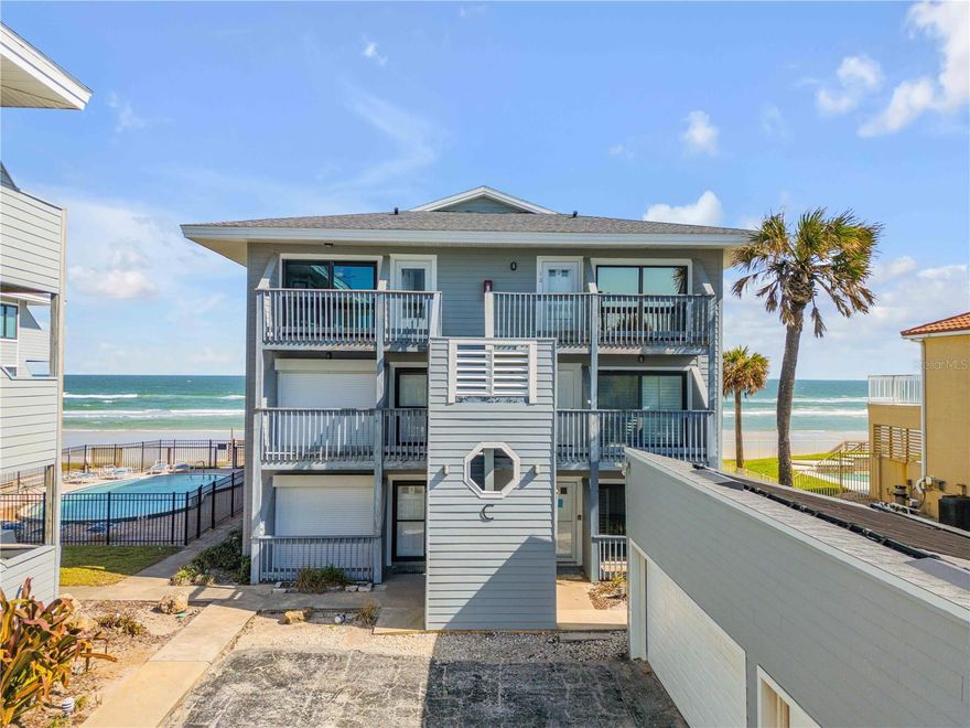 Enjoy stunning panoramic ocean views from this rare, direct oceanfront top-floor north end corner unit in beautiful Ponce Inlet, located on the highly desirable no-drive beach. This spacious 3-bedroom, 2.5-bath residence combines coastal elegance with modern comfort, featuring hurricane-rated impact glass windows and doors throughout for peace of mind. The open floor plan is filled with natural light and ocean breezes, and the unit includes a washer and dryer, brand-new 2025 AC system, and garage parking for convenience. Sold fully furnished, this home is truly move-in ready—perfect as a primary residence, weekend beach retreat, or investment property. Surrounded by the serene Ponce Preserve, residents can enjoy nature trails, unspoiled dunes, and access to the Intracoastal Waterway, offering the best of both the ocean and riverfront lifestyles. Experience the ultimate blend of privacy, luxury, and natural beauty in this exceptional Ponce Inlet oceanfront condo.