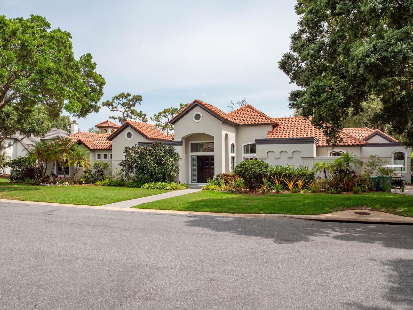 One or more photo(s) has been virtually staged. Situated along the 12th fairway of the exclusive Lake Nona Golf & Country Club, this recently updated and fully furnished residence offers a rare blend of resort-style living and wellness-inspired design. Centered around a private interior courtyard with a sparkling pool and spa, the home provides stunning views and direct pool access from nearly every room. With multiple lounge and entertaining areas, this home is as functional as it is welcoming.
The main residence features 4 bedrooms and 4 full bathrooms, in addition to a versatile guesthouse with private entry, kitchenette, convertible living/sleeping space, and dedicated 5th bedroom and bath.
A large wood entry door sets the tone upon arrival, leading into a media room with a billiard table and full-size projector. The layout flows seamlessly to a formal dining area into the open-concept kitchen, which includes a generous island, ZLINE gas stove, breakfast nook and wine refrigerator.
The primary suite boasts a tranquil garden-style clawfoot tub, spacious walk-in shower, two custom walk-in closets, and a private sitting area with direct outdoor access. The secondary primary suite includes its own ensuite bath with a garden tub, walk-in shower, dry sauna, and oversized walk-in closet - ideal for guests or multi-generational living.
Additional features include I Spring, three-stage whole house water filtration system, EV charging, golf cart parking, Florida-friendly vegetable garden lovingly curated by the owner.
Rent includes home cleaning service, cable TV, utilities, gas, internet, trash collection, pool maintenance, pest control, landscaping and gardening services. Green home features include solar power, HVAC UV/electrostatic filtration, native landscaping, non-toxic treatments and low-VOC finishes. This exceptional home is perfect for entertaining, relaxation, or those seeking a wellness-focused lifestyle.