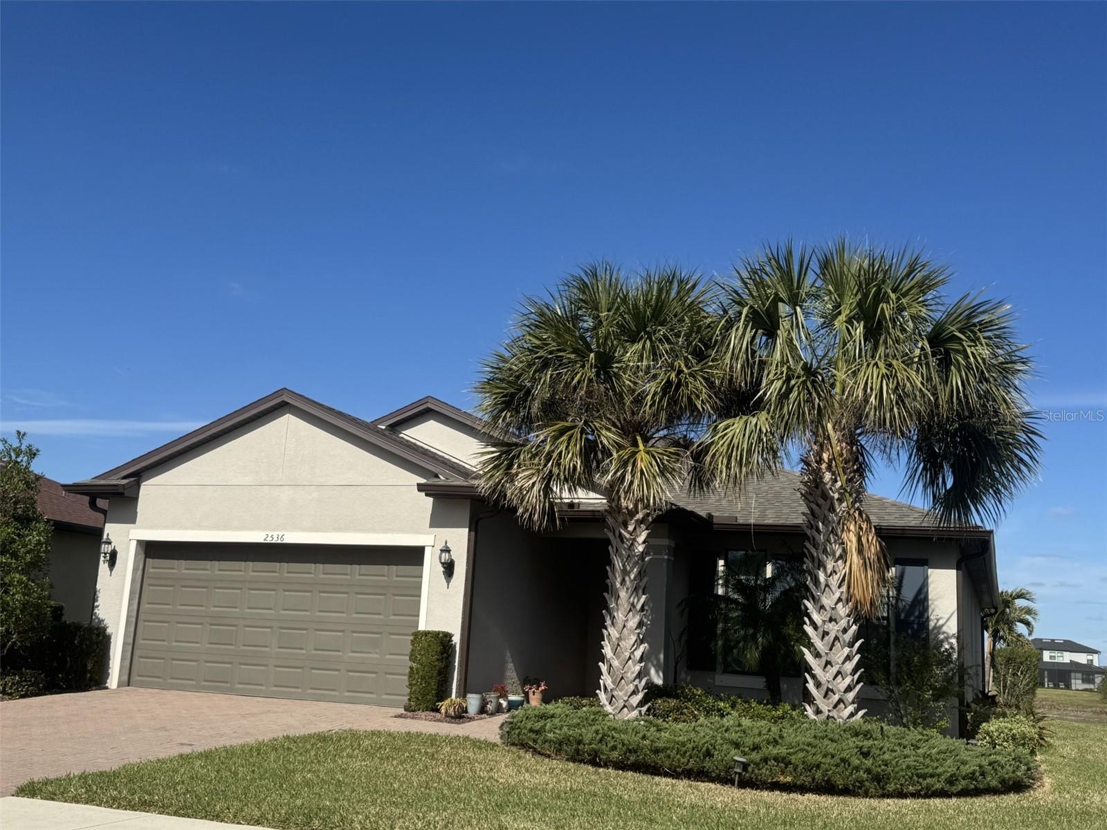 Come tour this meticulously maintained three bedroom plus flex/office/bedroom, two-bathroom home with beautiful lake views. This gem is located in the highly desirable, all-age community of Cedar Grove at The Woodlands with community amenities like a neighborhood heated pool, pool cabana, and HOA fee that includes lawn care. Step into an open-concept layout with vaulted ceilings and an enclosed lanai that offers stunning lake and preserve views visible from from living area and master bedroom. The gorgeous sunsets and exquisite array of wildlife and birds The gourmet chef's kitchen is a masterpiece, featuring exquisite granite countertops, high-end finishes, under cabinet lighting and a beautiful island that seats four. The primary suite is a private retreat, boasting a spa-inspired bathroom. Elegant tile flooring flows throughout and walk-in closets in every bedroom. Hurricane shutters provide peace of mind and an oversized two car garage features a workshop, garden sink and overhead storage. Visit the 22 added "upgrades list" the owners chose for their dream home they must now give up to move near family. List is also on the kitchen counter with all manuals and warranties as well as attached here w/the owners disclosures. One of my favorites is the extra storage shelves utilizing 9’ ceilings w/ 8’ high doors. Roof is 2yrs new. Enjoy all Florida has in a great home for entertaining, raising a family, or to relax after a hard day at work. A short distance to shopping, restaurants, schools and 10 min to the interstate or Sarasota Hospital. Punta Gorda airport is 1/2 hour away, the beautiful beaches of Southwest Florida are only a 30-45 minute drive, and the Atlanta Braves spring training & Cool Today waterpark is 20 minutes away.